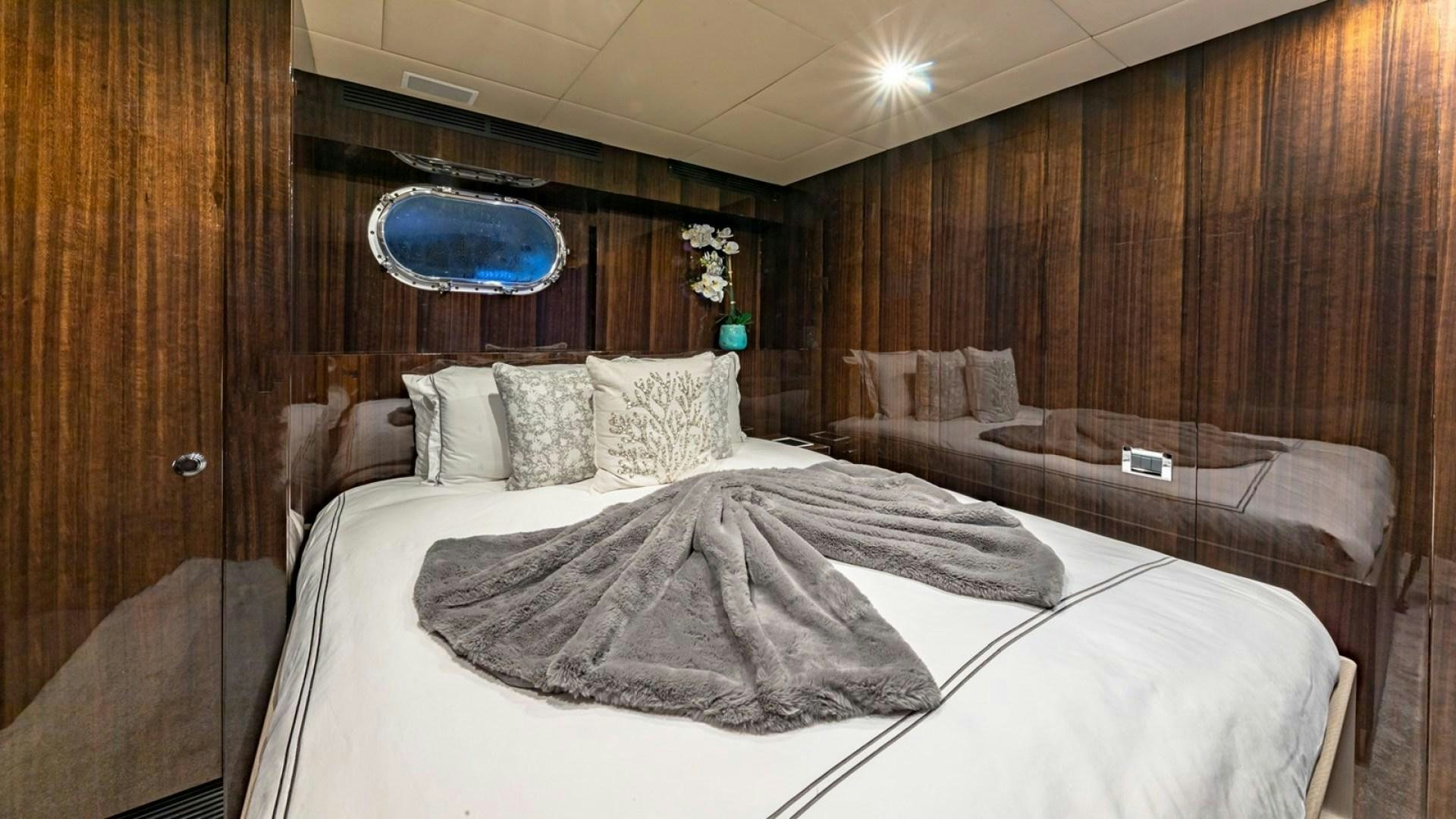 a room with two beds aboard OCULUS Yacht for Sale
