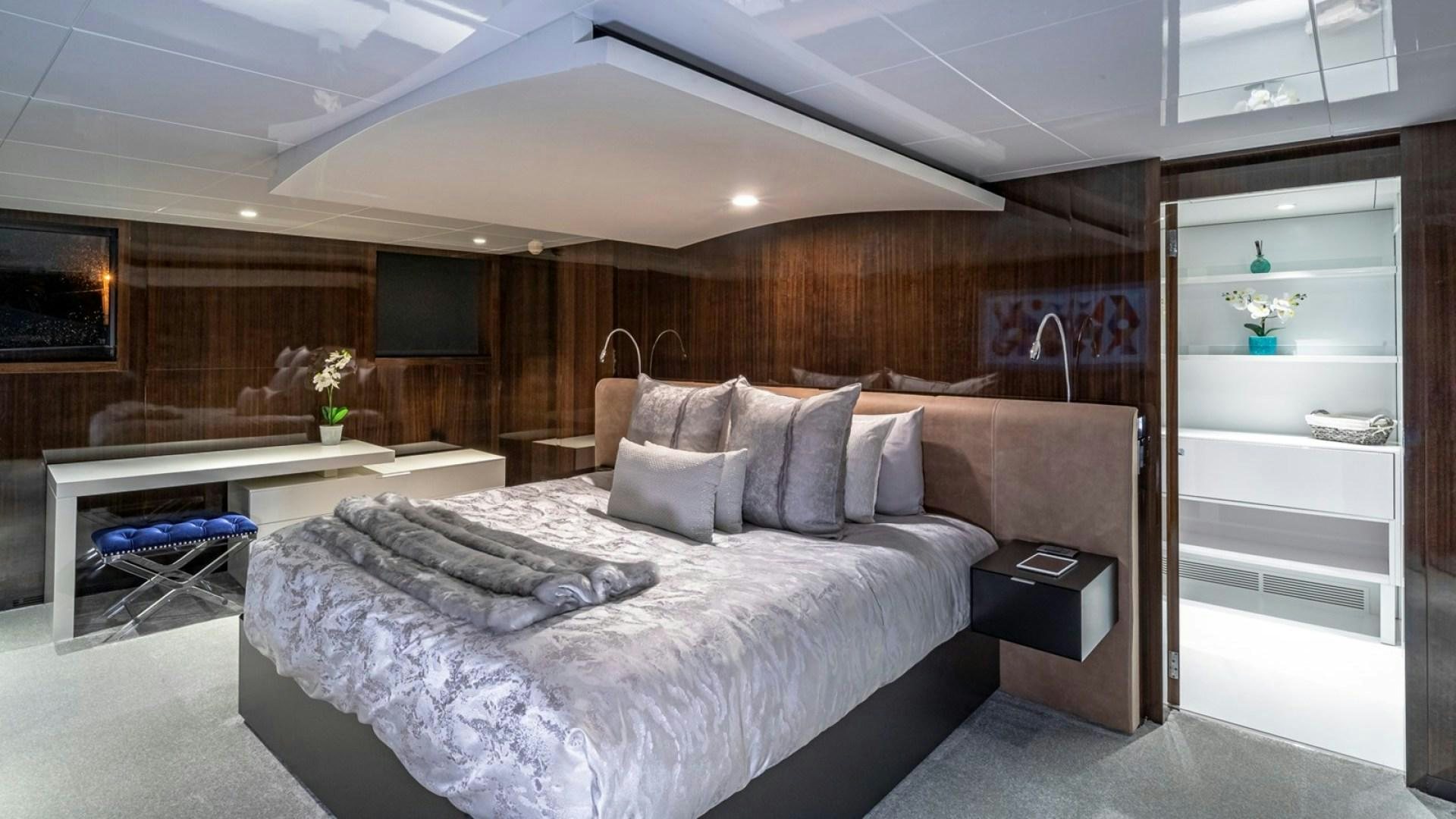 a bed in a room aboard OCULUS Yacht for Sale