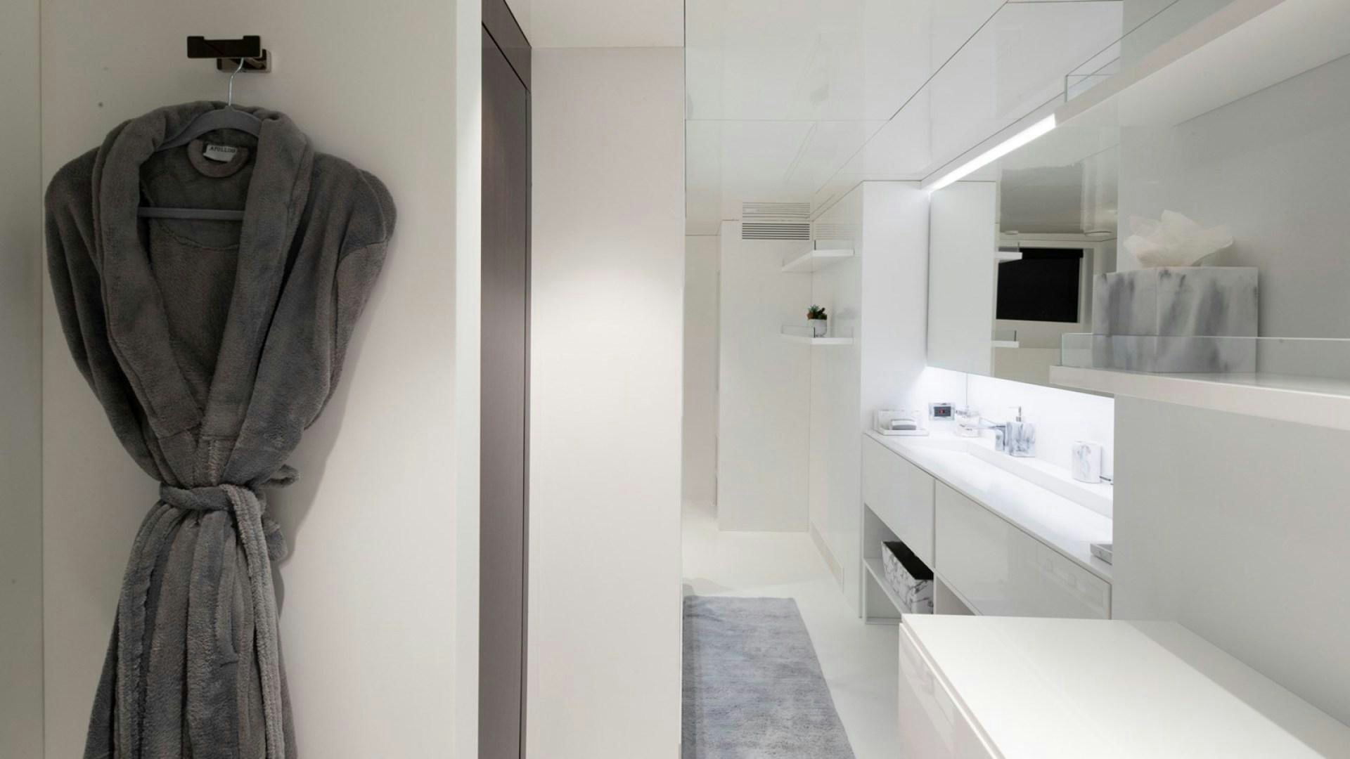 a bathroom with a sink and a mirror aboard OCULUS Yacht for Sale