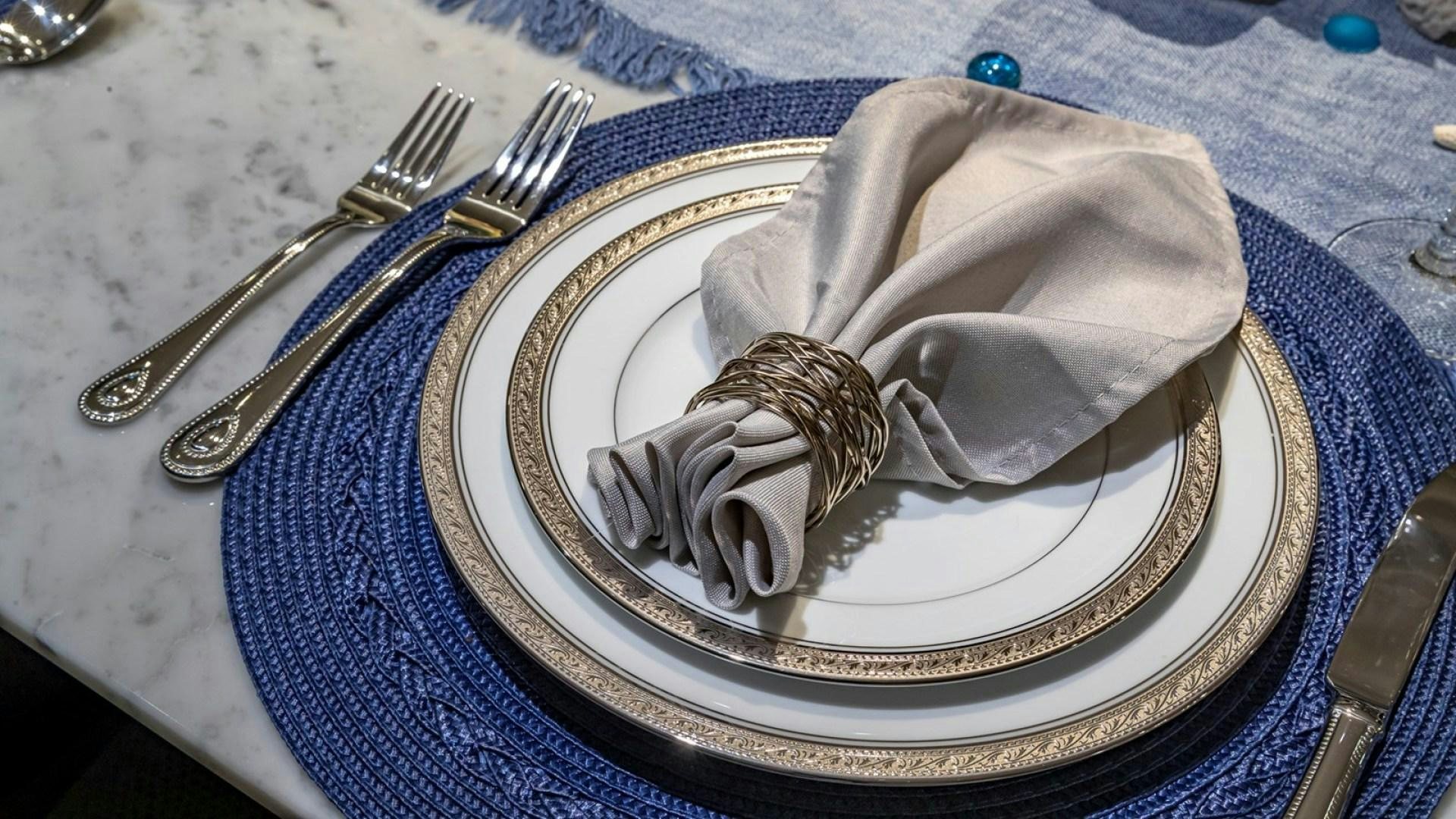 a plate with a bag and fork on it aboard OCULUS Yacht for Sale