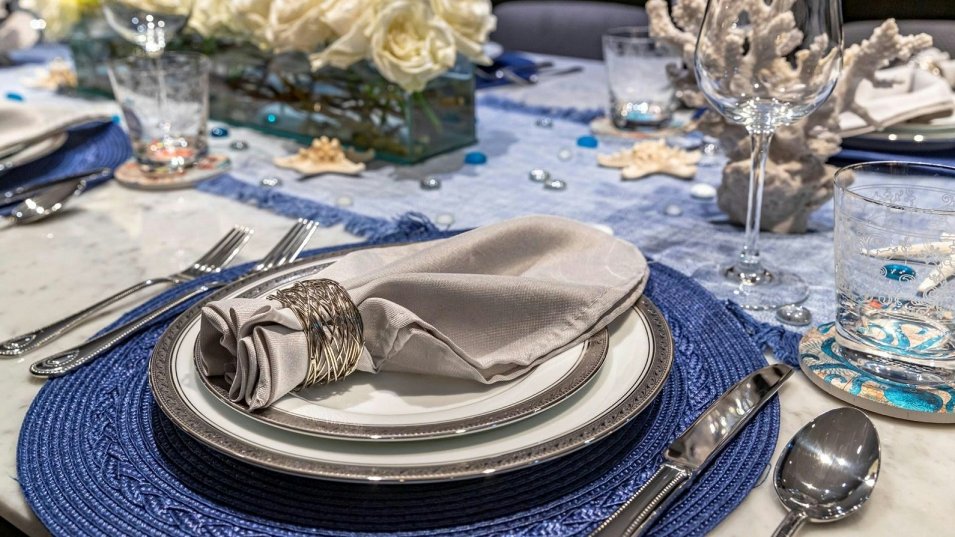 a plate with a slice of cake on it aboard OCULUS Yacht for Sale