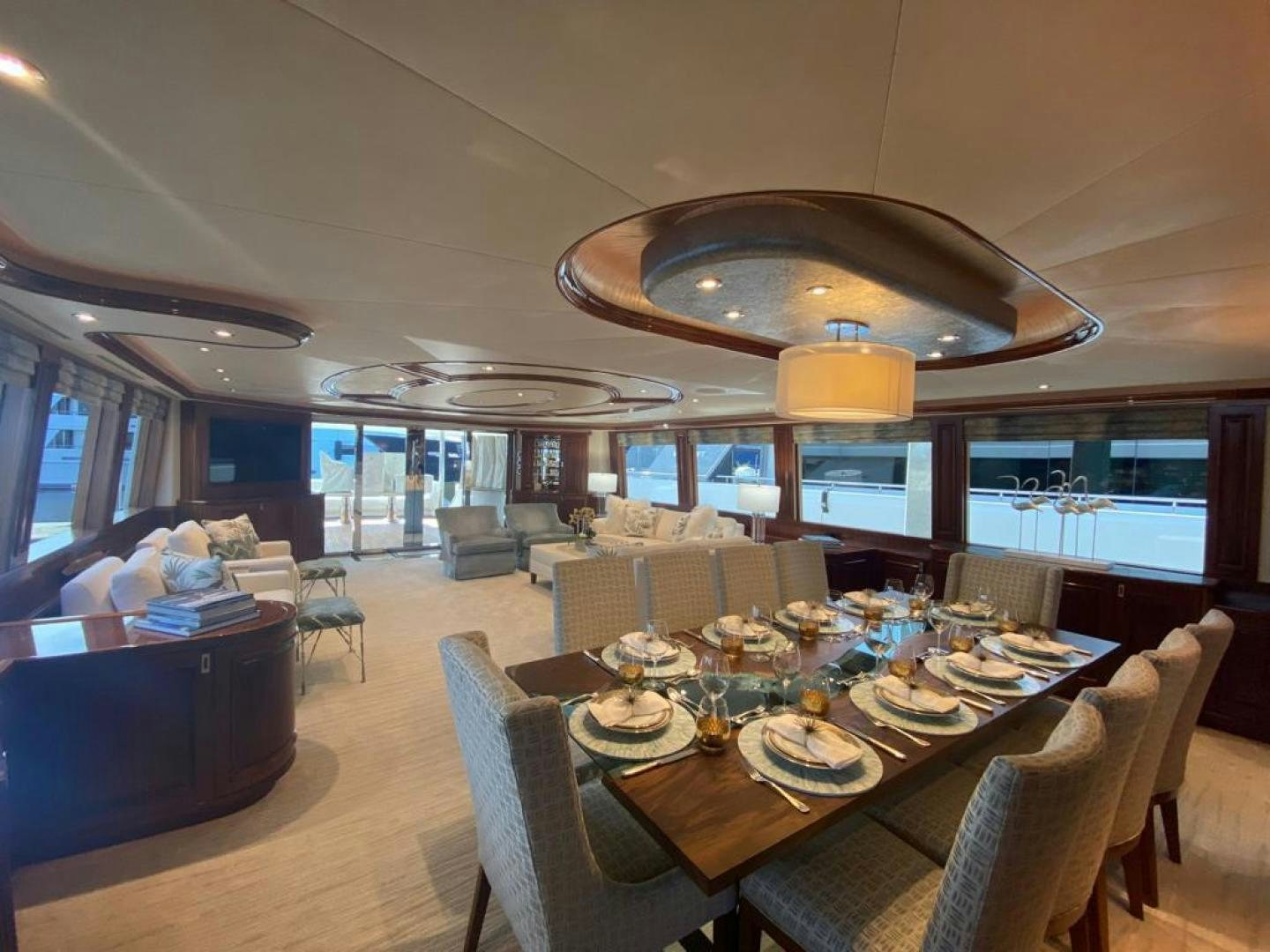 a dining room with a table and chairs aboard YES Yacht for Sale
