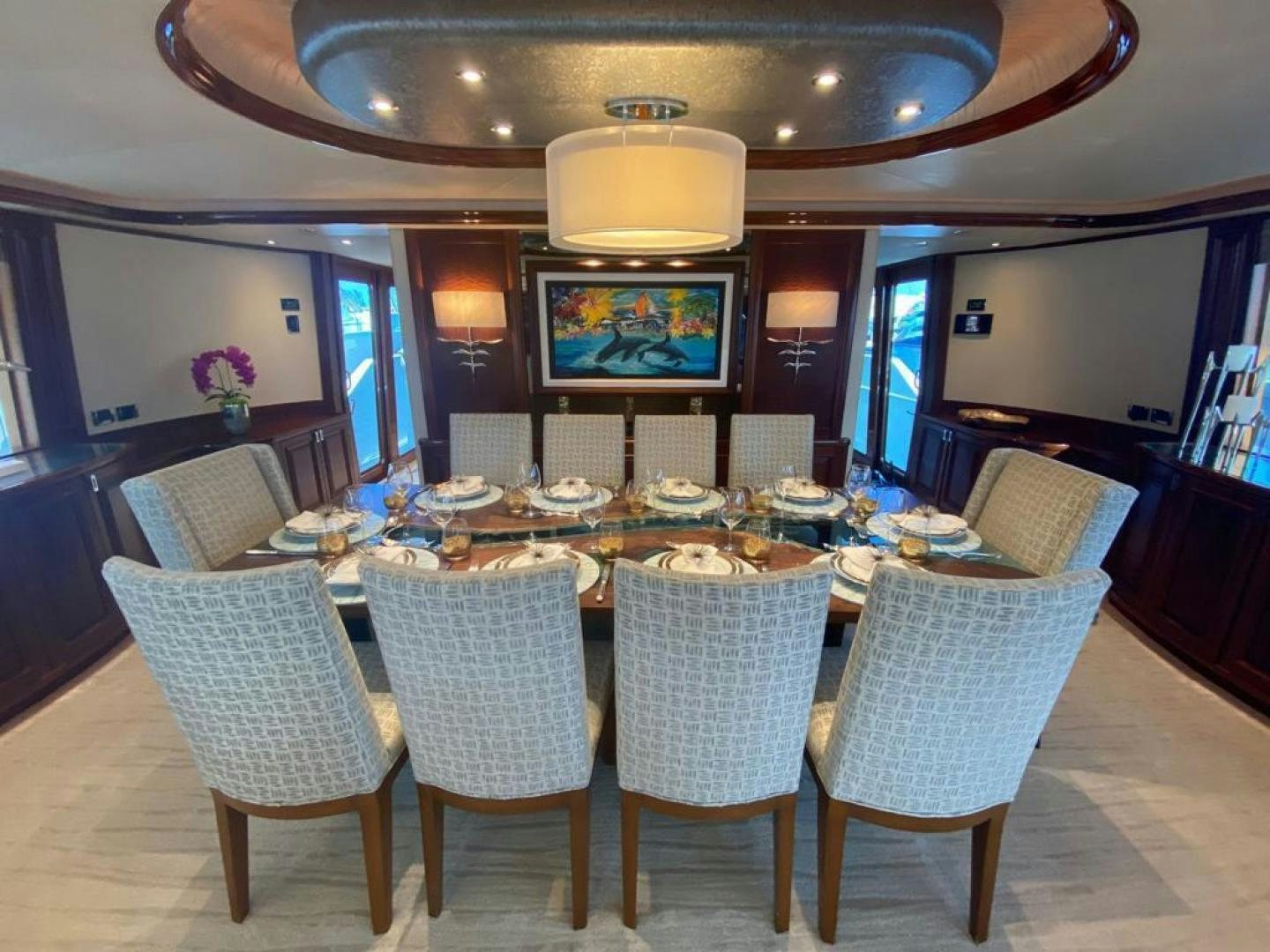 a large dining room with a large table and chairs aboard YES Yacht for Sale