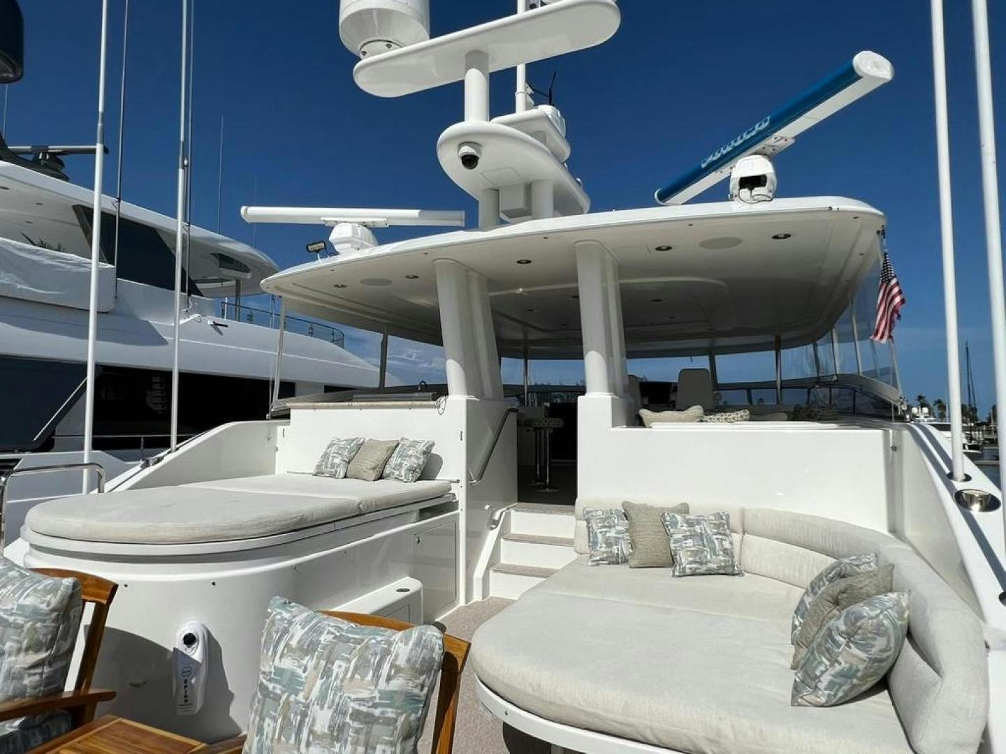 a boat with a white bed and white beds on it aboard YES Yacht for Sale