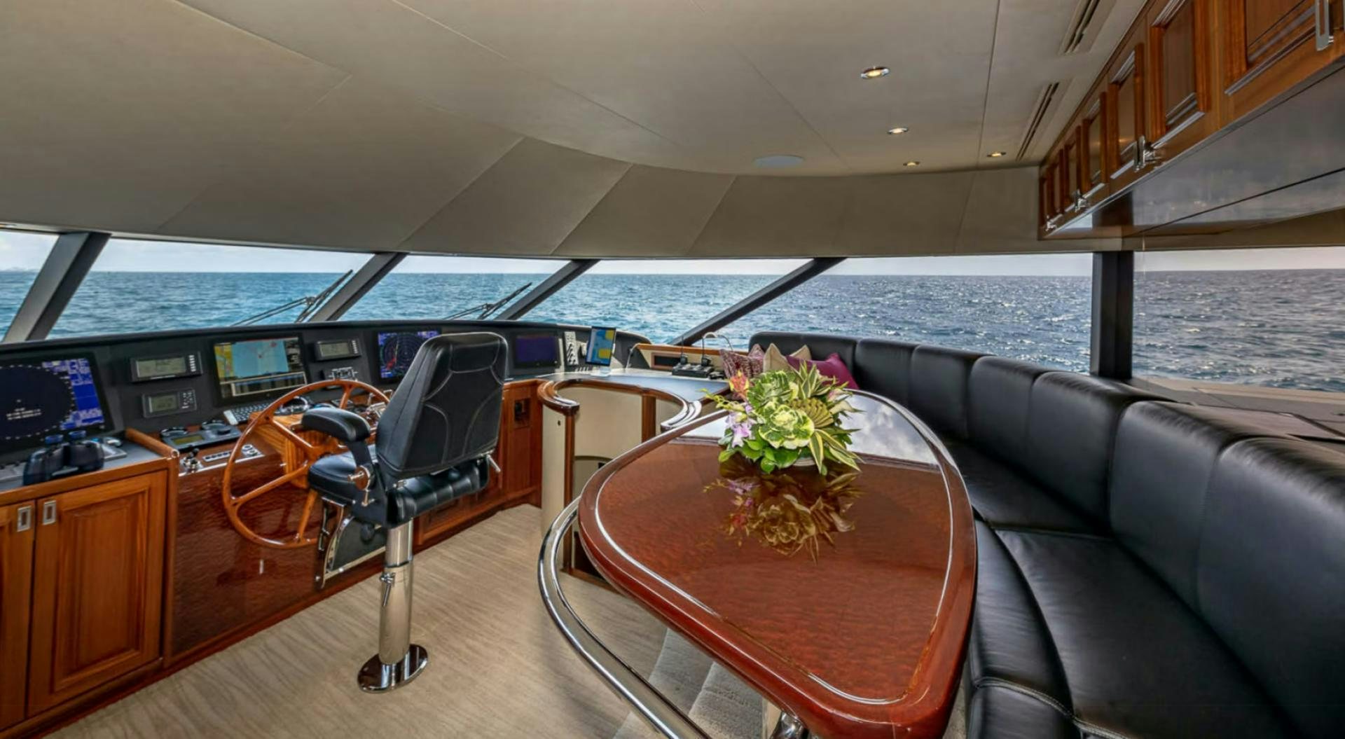 a table with a plant on it aboard YES Yacht for Sale