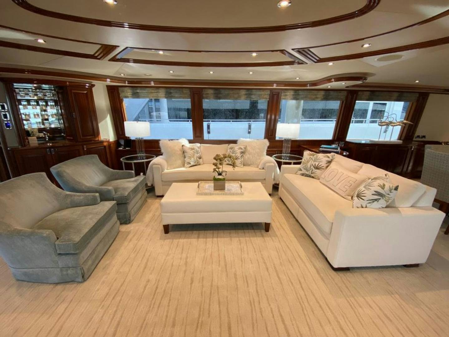 a living room with a large window aboard YES Yacht for Sale