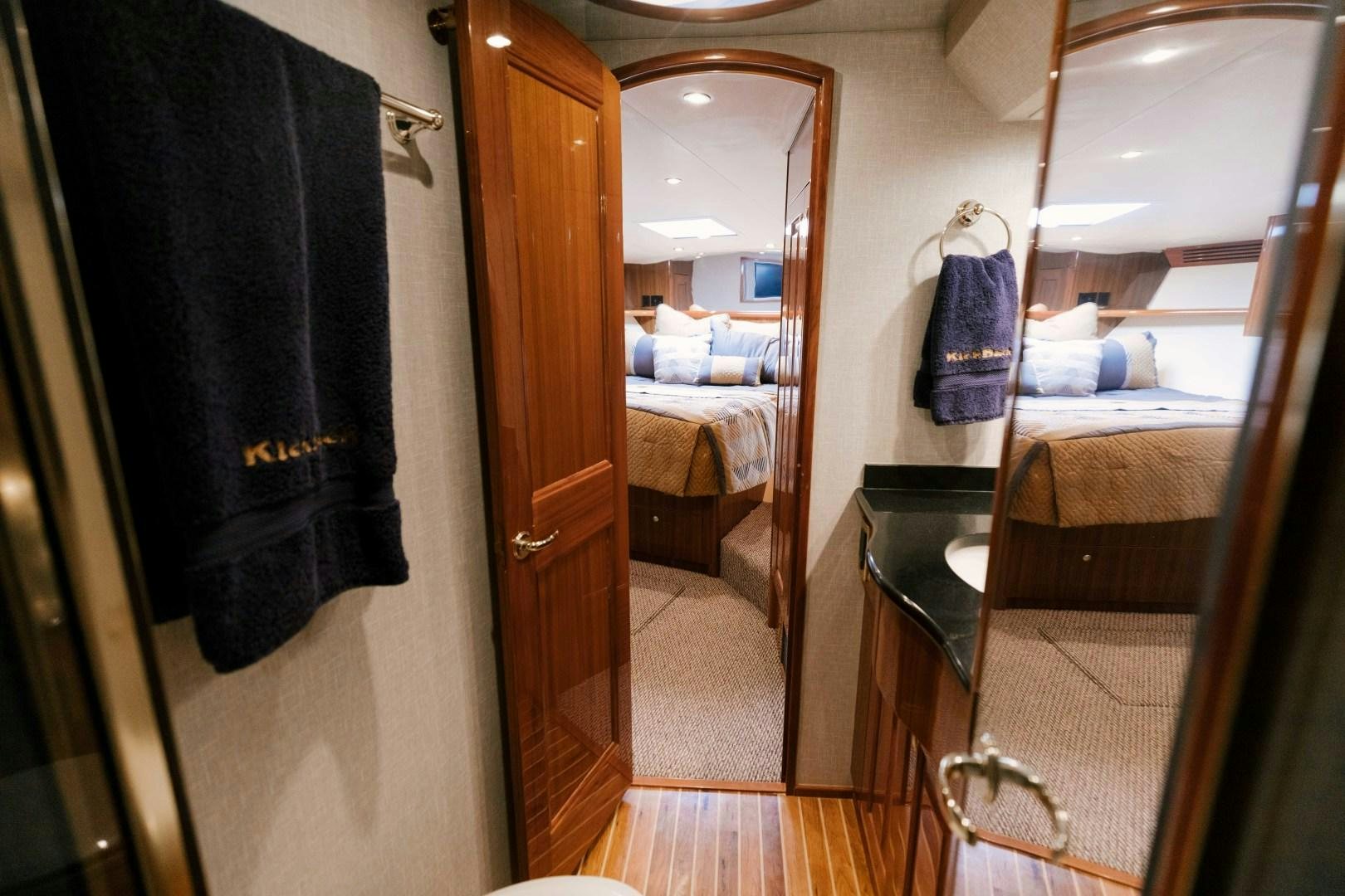 a bathroom with a bed and a closet aboard KICKBACK Yacht for Sale