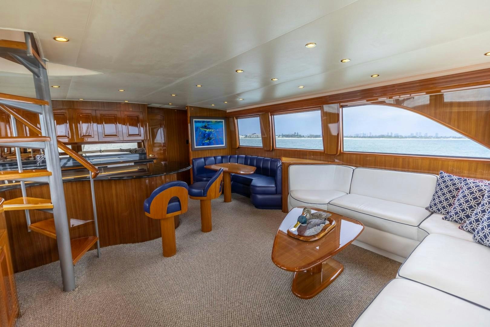 a living room with a large window aboard KICKBACK Yacht for Sale