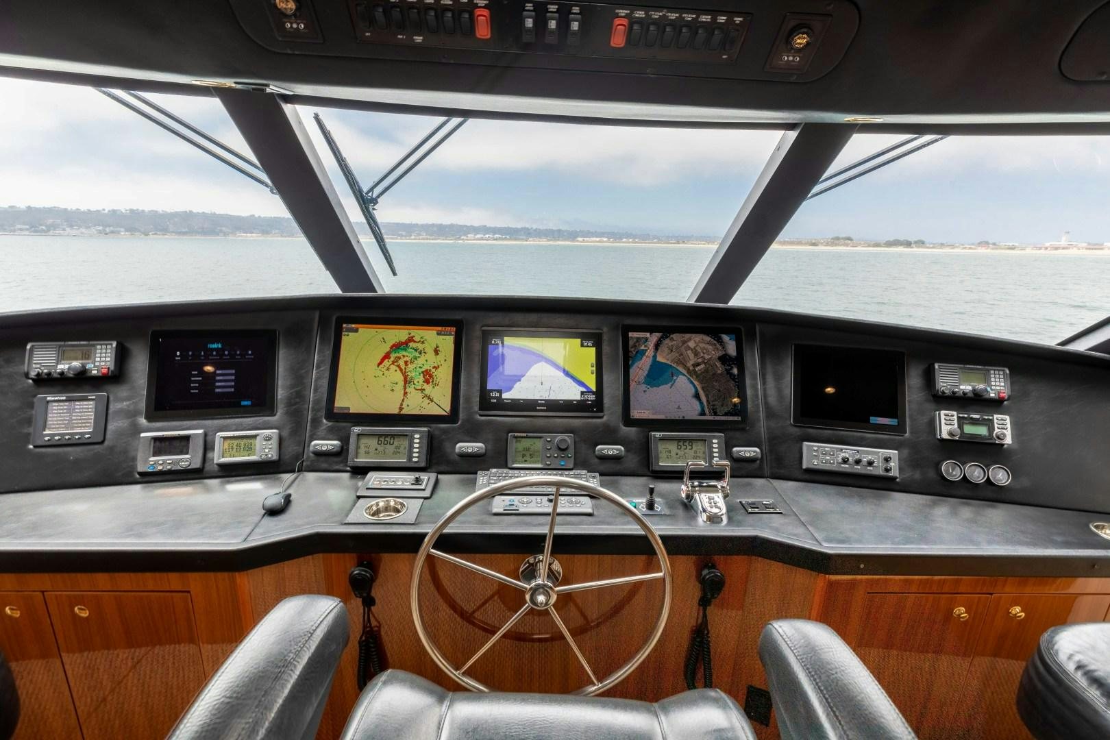 inside of a vehicle with many screens aboard KICKBACK Yacht for Sale