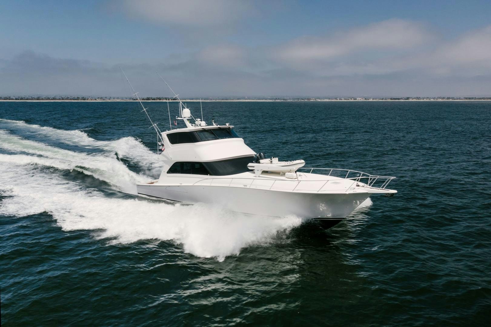 a white boat on the water aboard KICKBACK Yacht for Sale