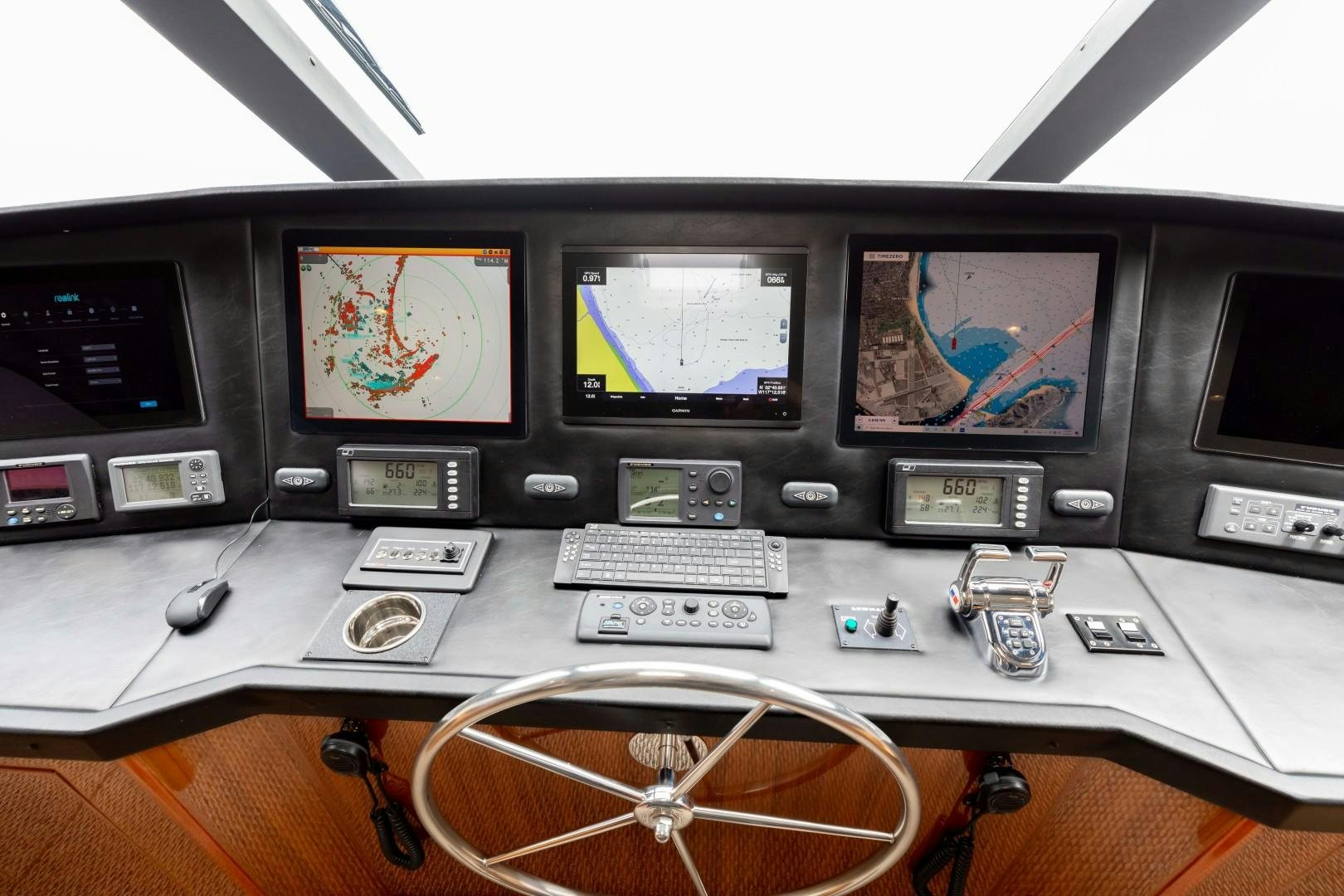 a table with many electronic devices aboard KICKBACK Yacht for Sale