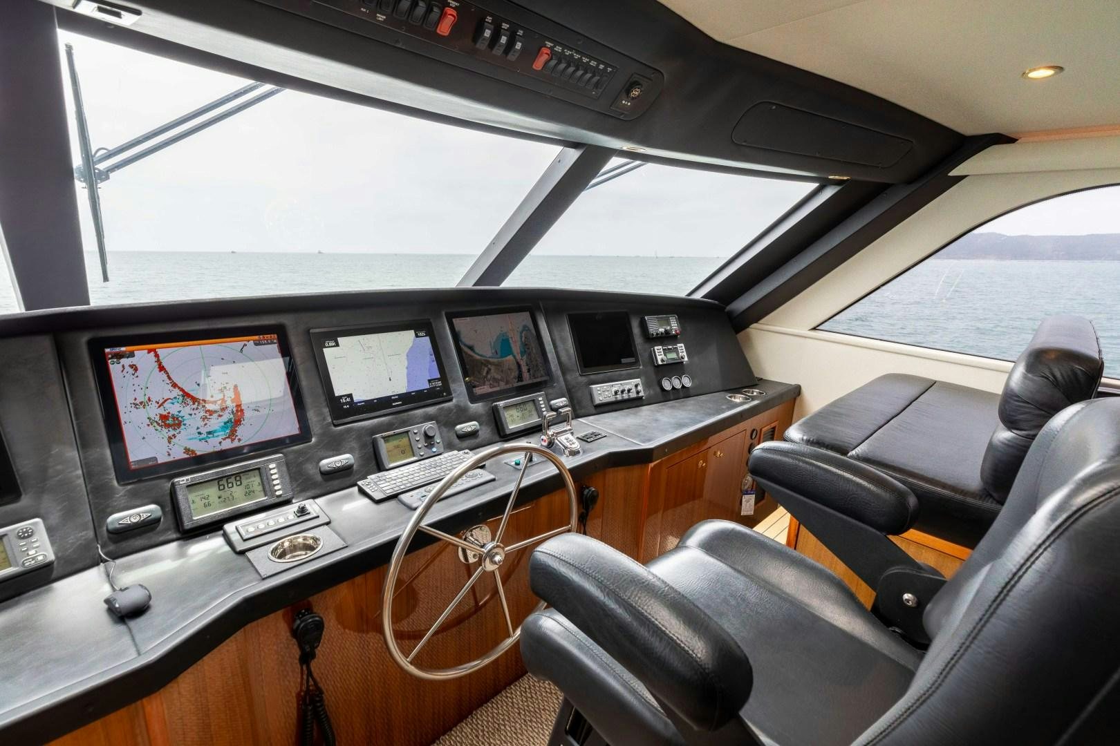 inside of a car with monitors and screens aboard KICKBACK Yacht for Sale