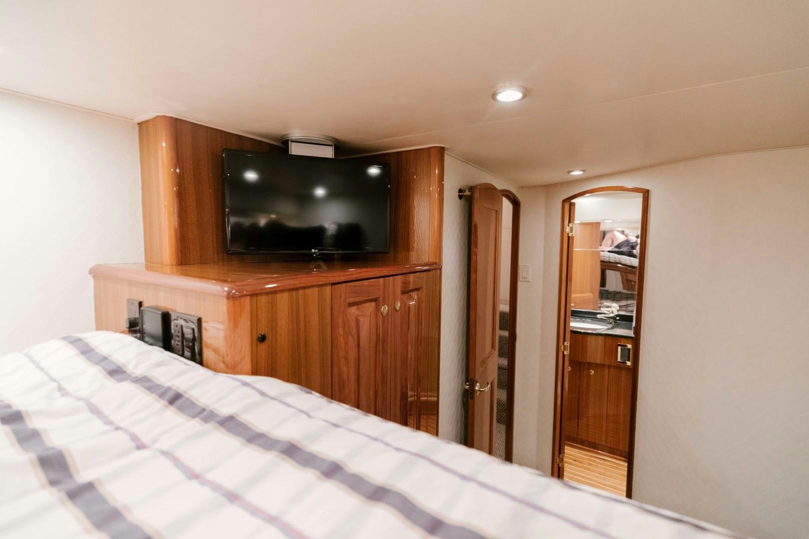 a tv on a dresser aboard KICKBACK Yacht for Sale