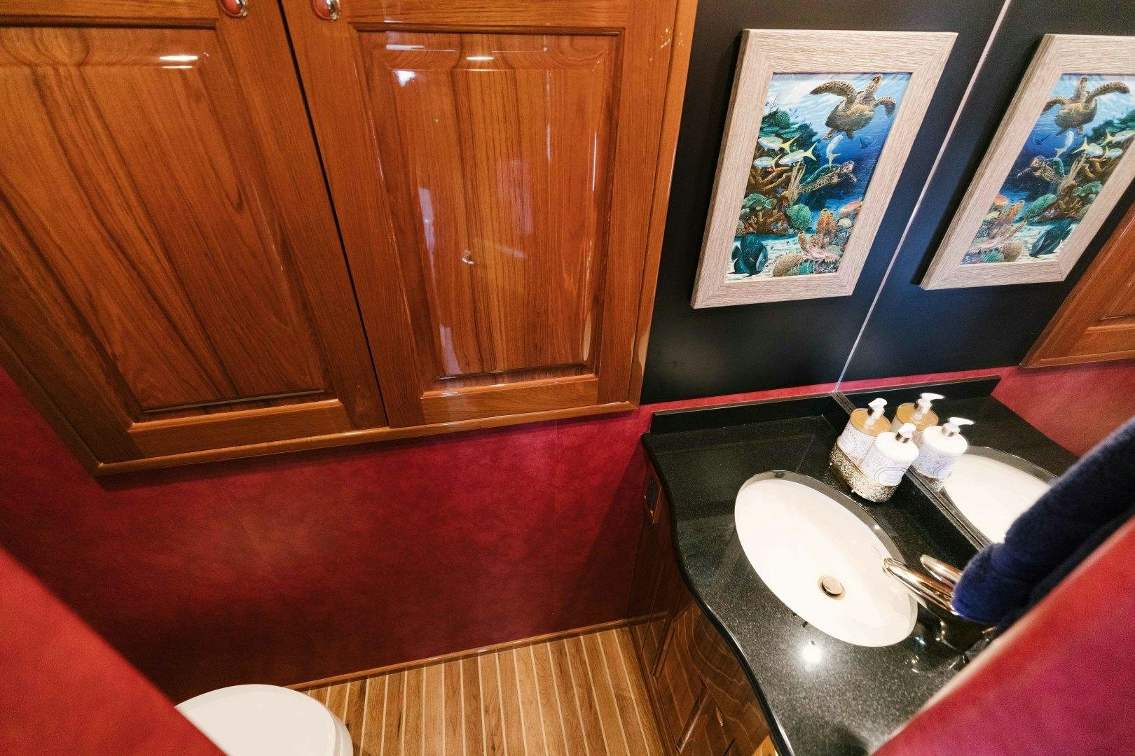 a person is cooking in a kitchen aboard KICKBACK Yacht for Sale