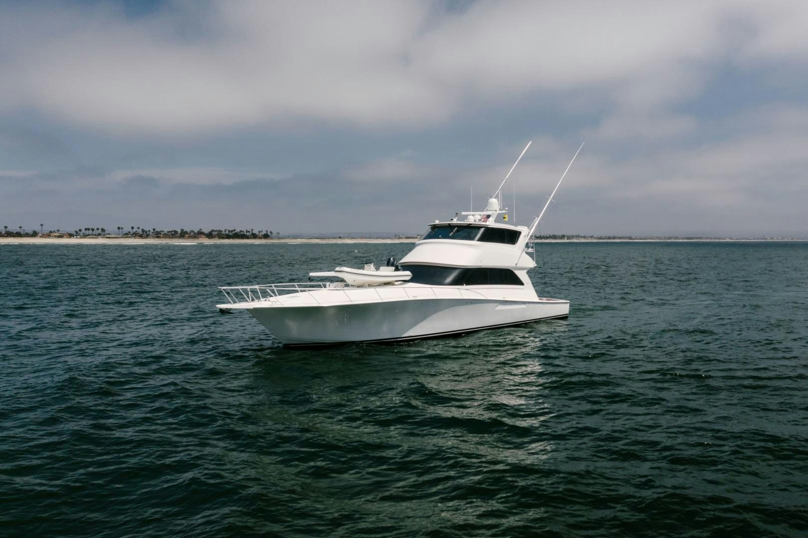 a white boat in the water aboard KICKBACK Yacht for Sale