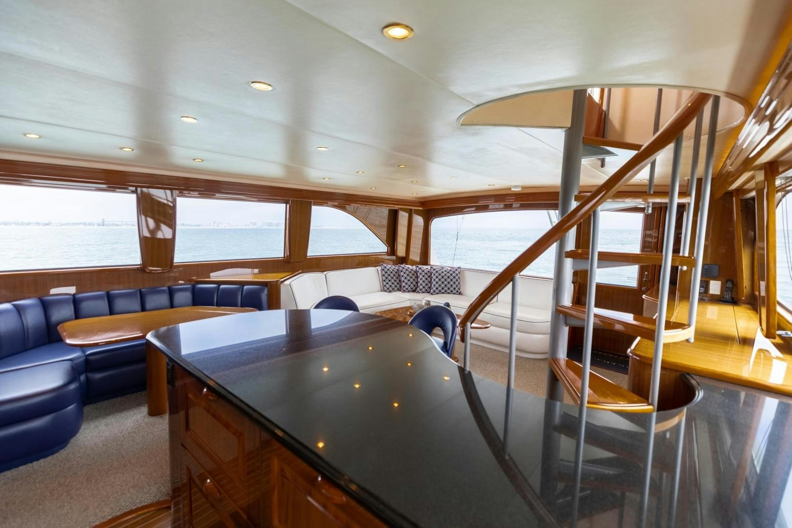 a room with a table and chairs aboard KICKBACK Yacht for Sale