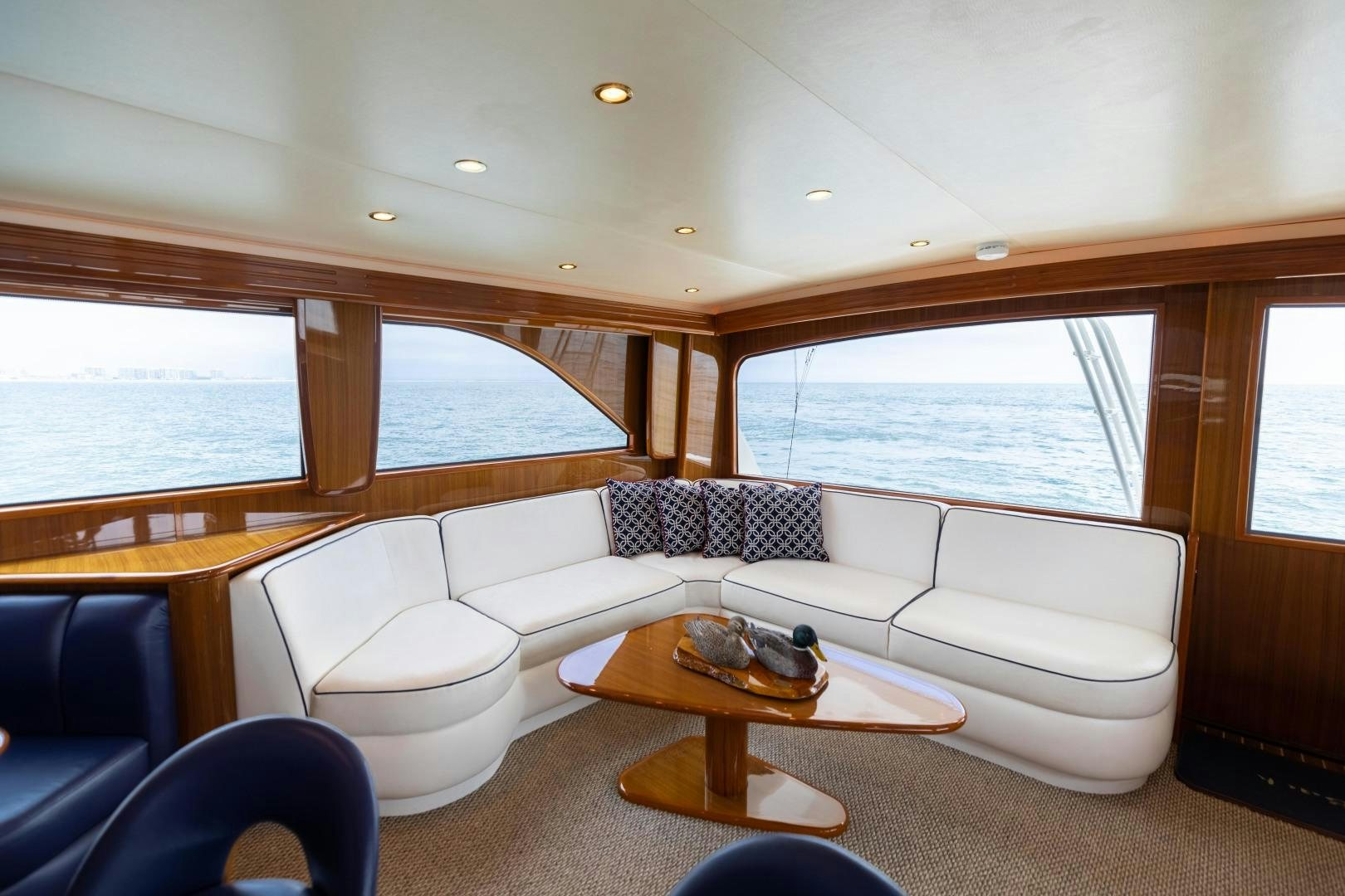 a living room with a large window aboard KICKBACK Yacht for Sale
