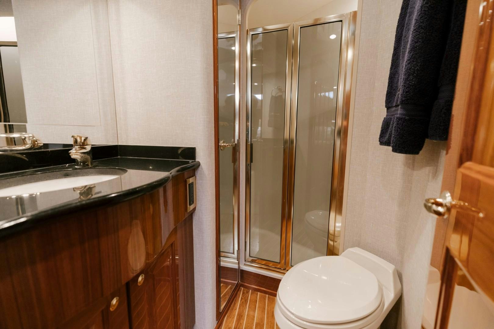 a bathroom with a glass shower aboard KICKBACK Yacht for Sale