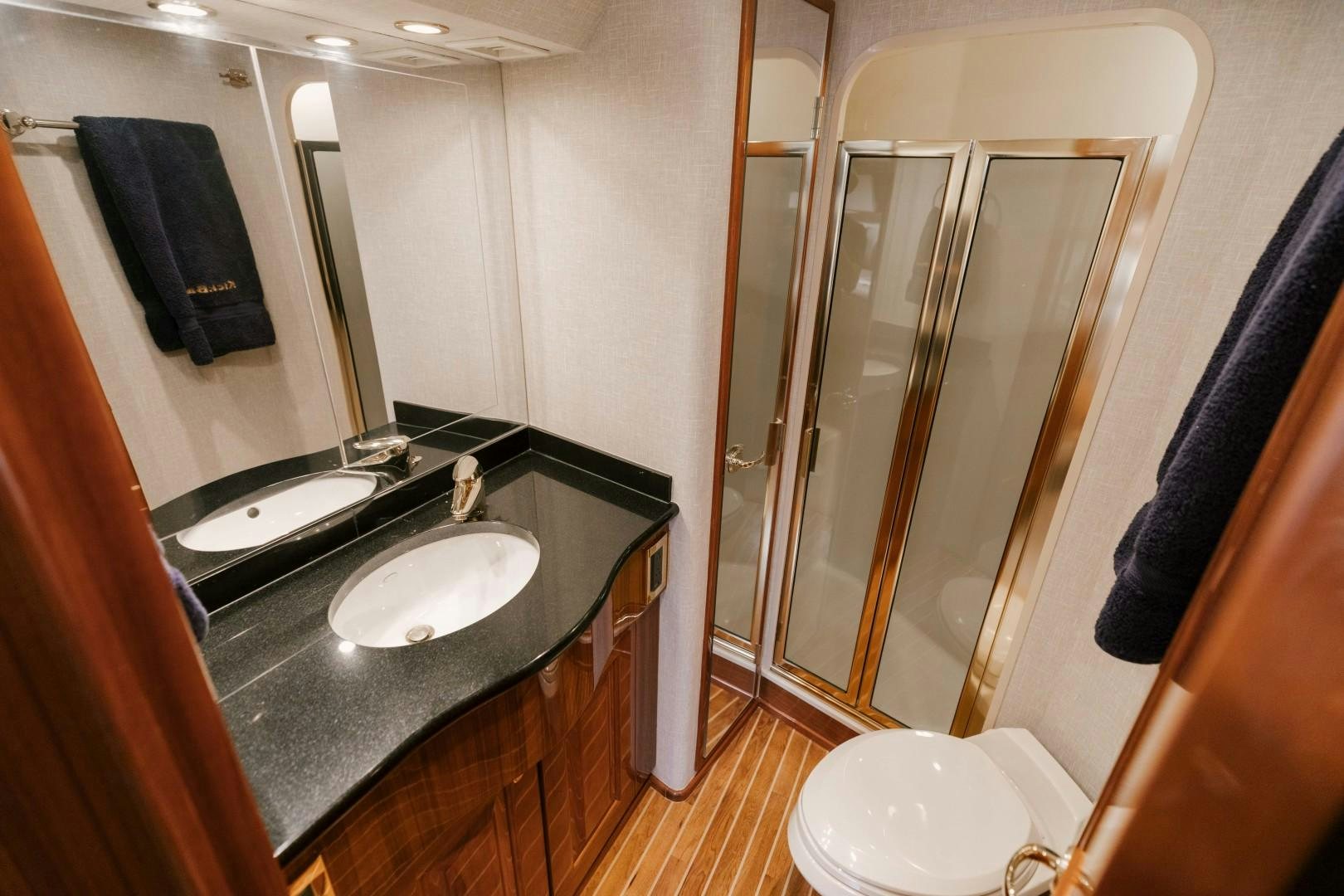 a bathroom with a sink and a shower aboard KICKBACK Yacht for Sale
