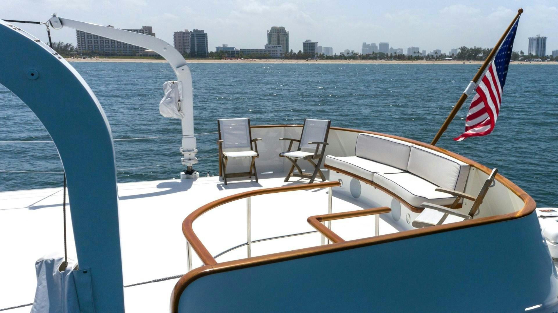 a boat with a flag on it aboard NEREUS Yacht for Sale