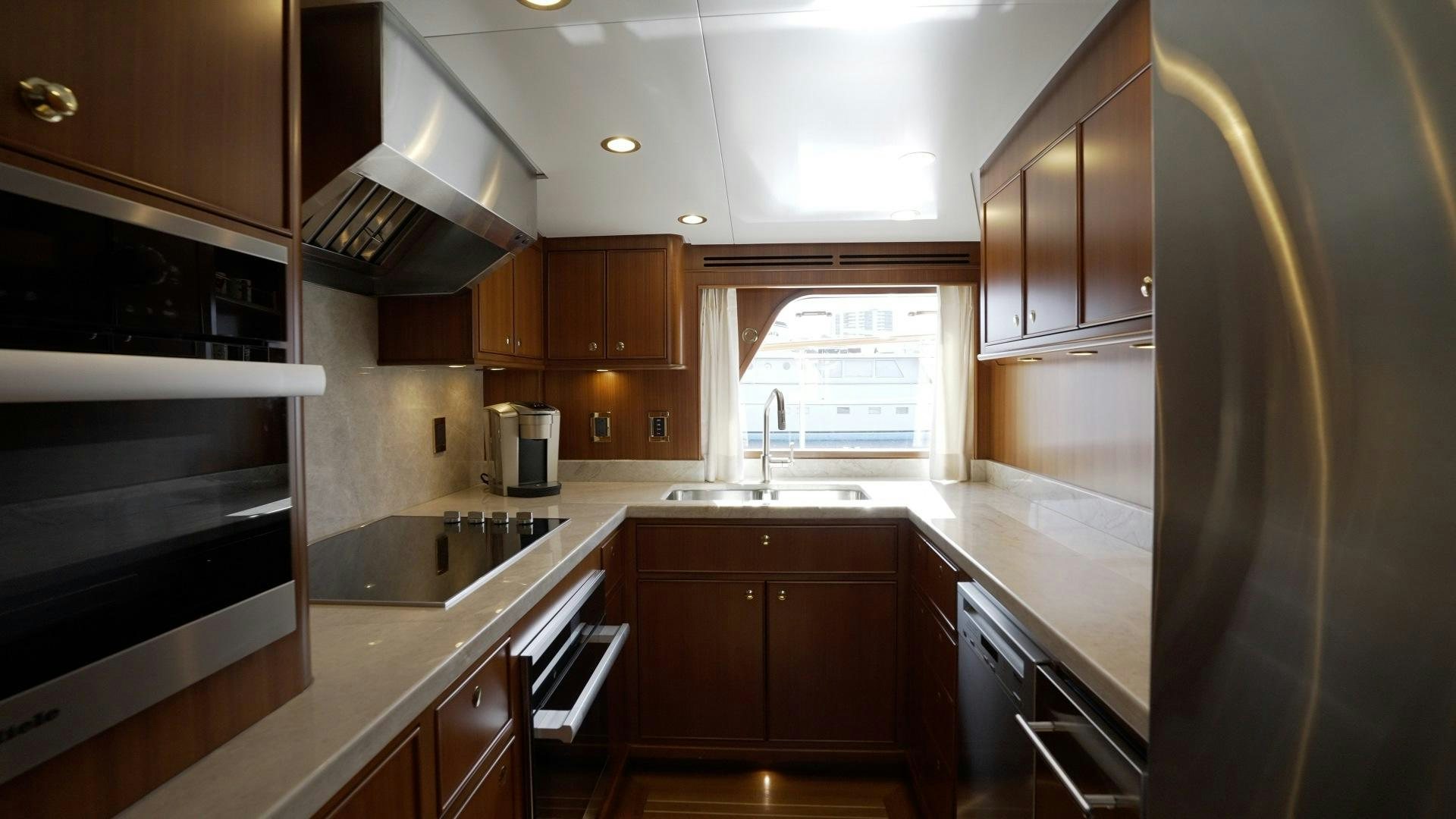 a kitchen with a stove and oven aboard NEREUS Yacht for Sale