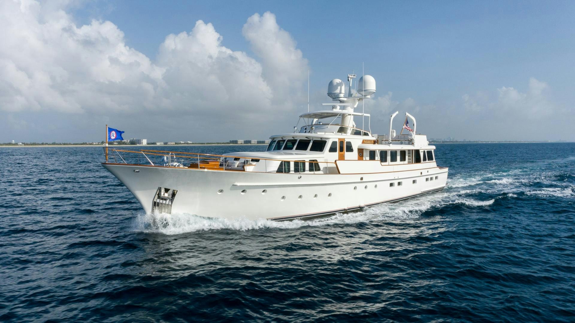 a white boat in the water aboard NEREUS Yacht for Sale