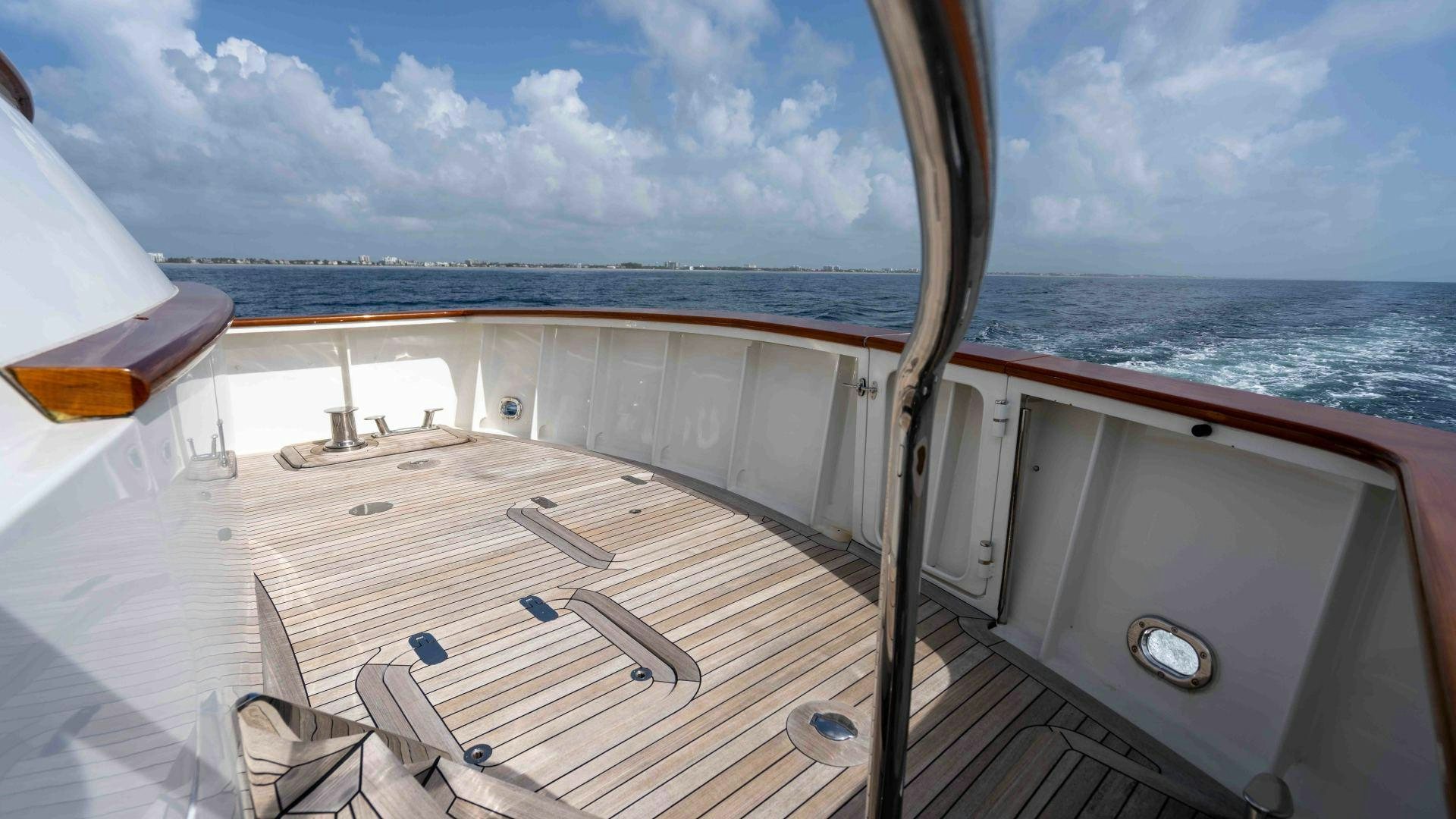 a deck with a view of the ocean and the ocean aboard NEREUS Yacht for Sale