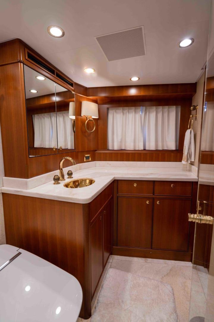 a bathroom with a sink and cabinets aboard NEREUS Yacht for Sale