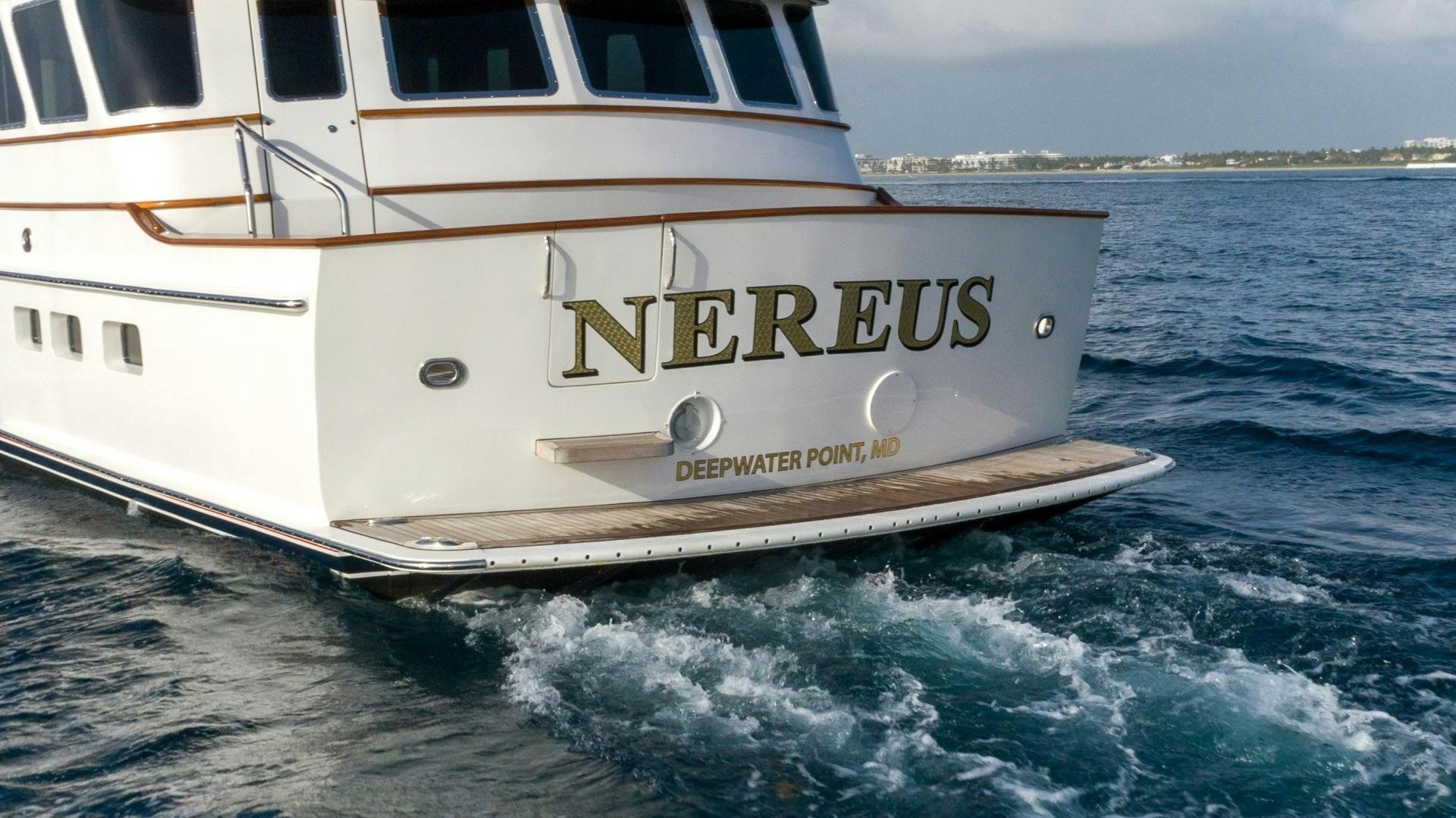 a white boat on the water aboard NEREUS Yacht for Sale