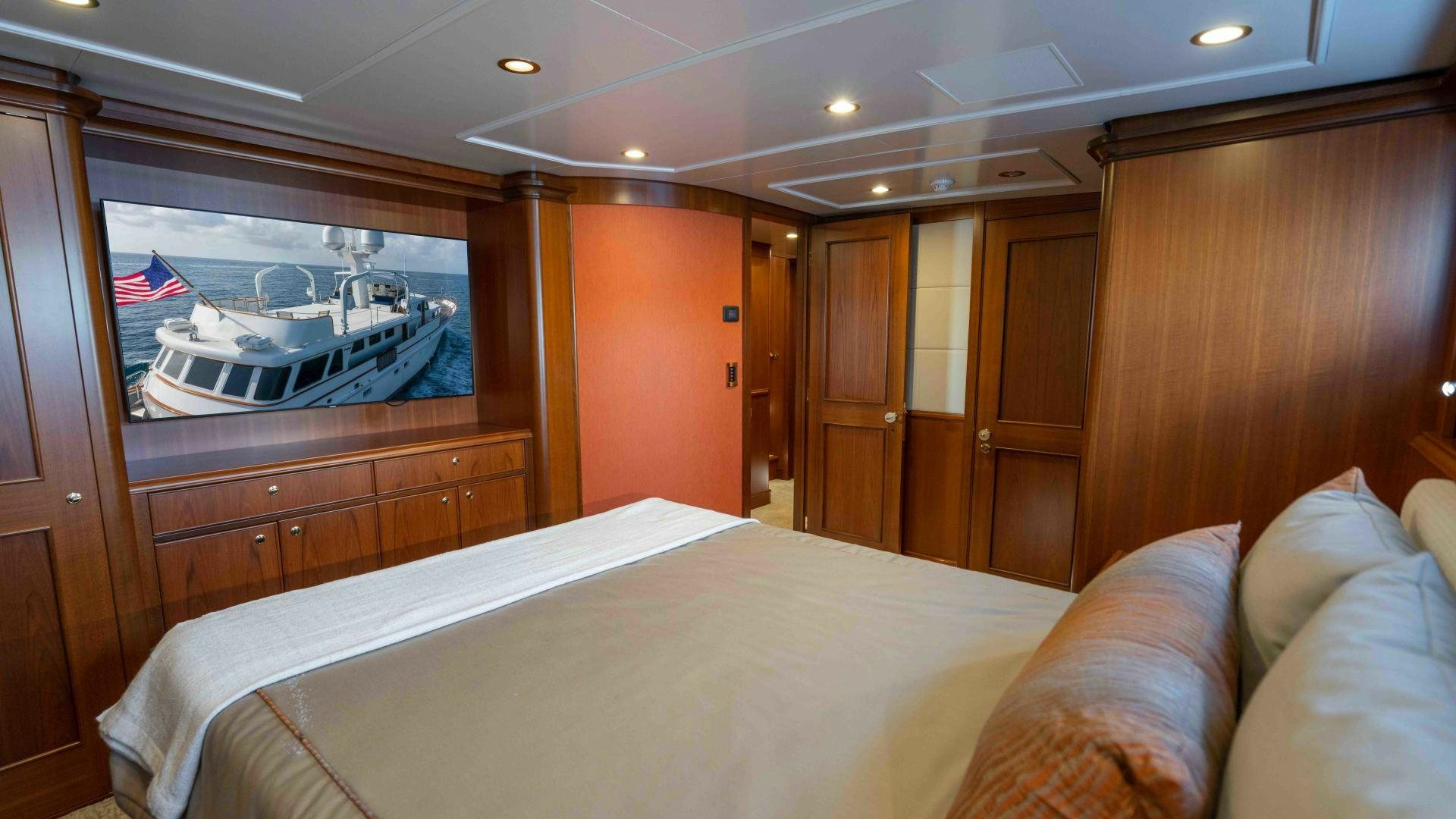 a bed in a room aboard NEREUS Yacht for Sale