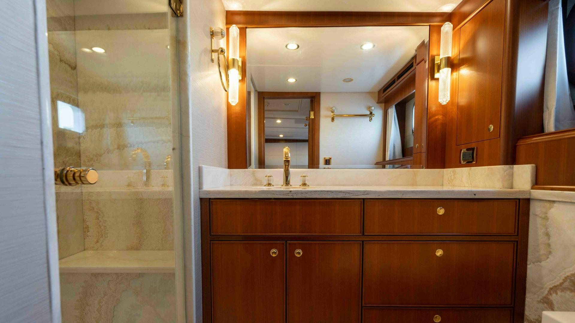 a bathroom with a large mirror aboard NEREUS Yacht for Sale