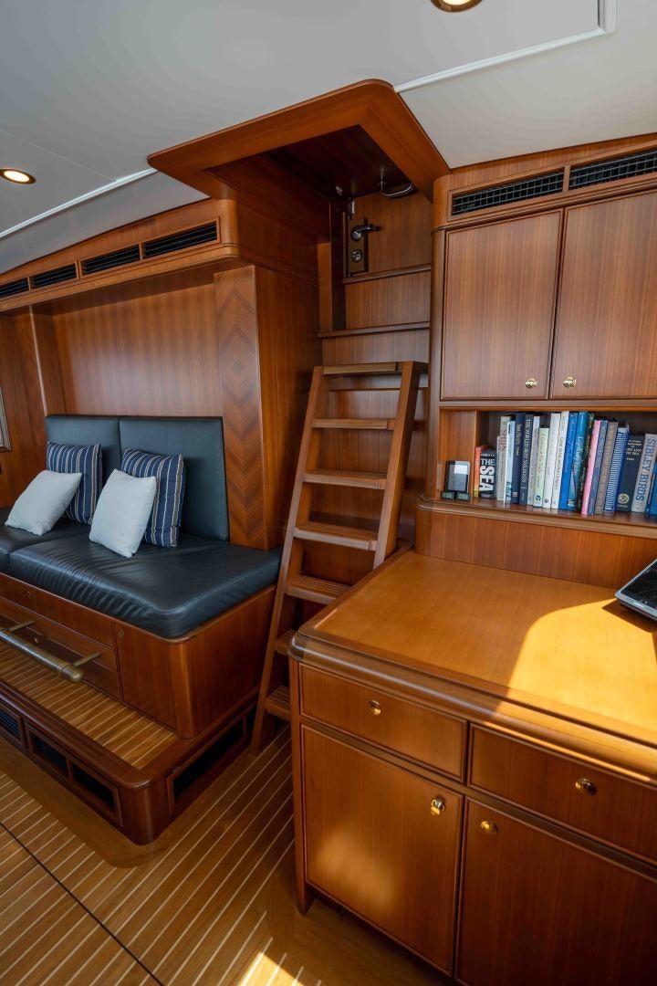 a room with a couch and a desk aboard NEREUS Yacht for Sale