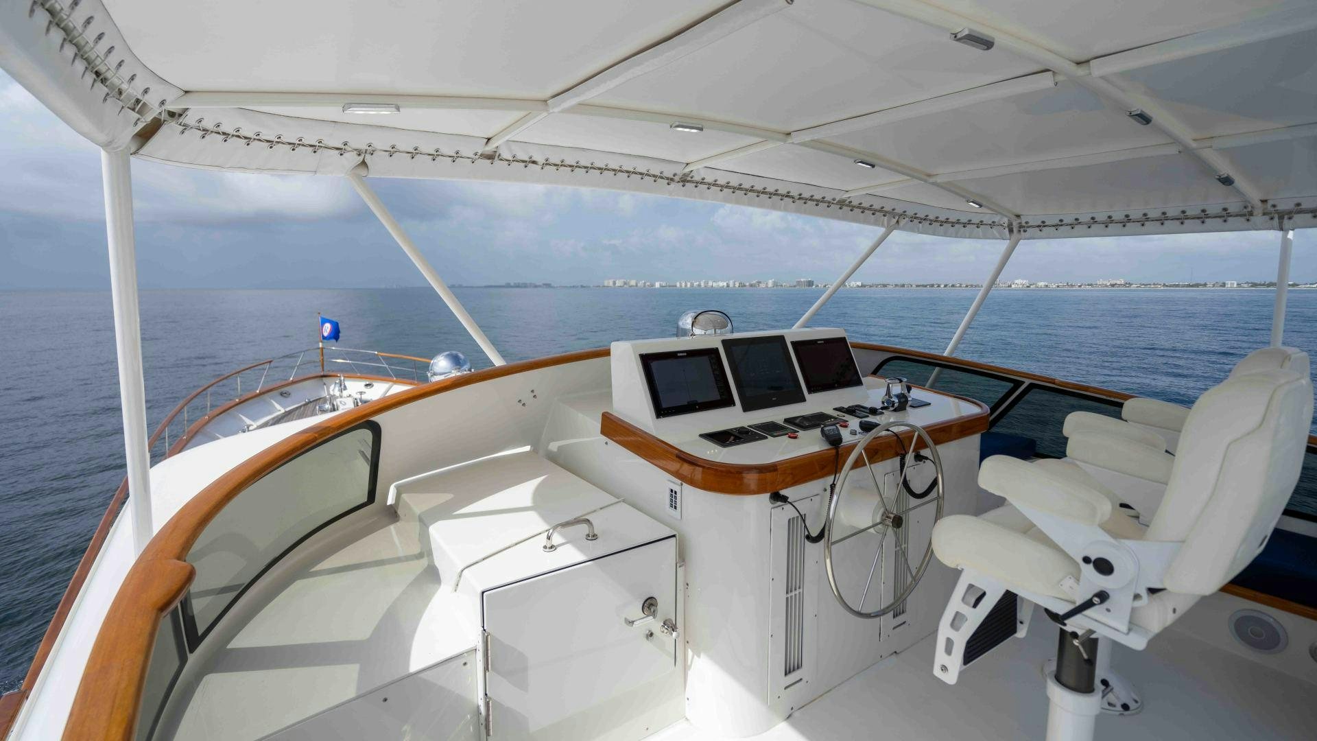 a boat with a desk and laptops on it aboard NEREUS Yacht for Sale