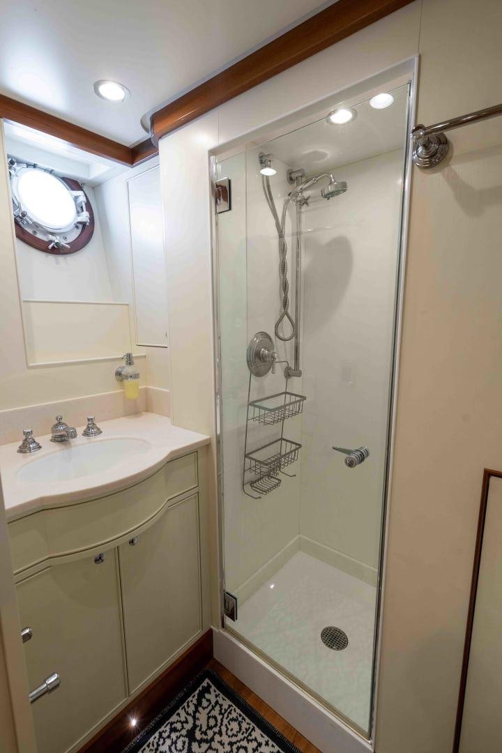 a bathroom with a shower unit and sink aboard NEREUS Yacht for Sale