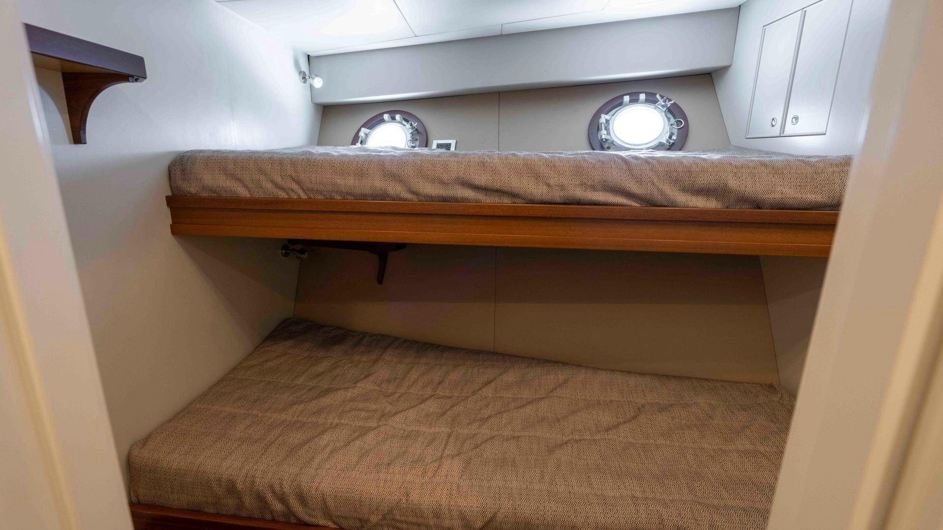 a wooden shelf with a round fan aboard NEREUS Yacht for Sale