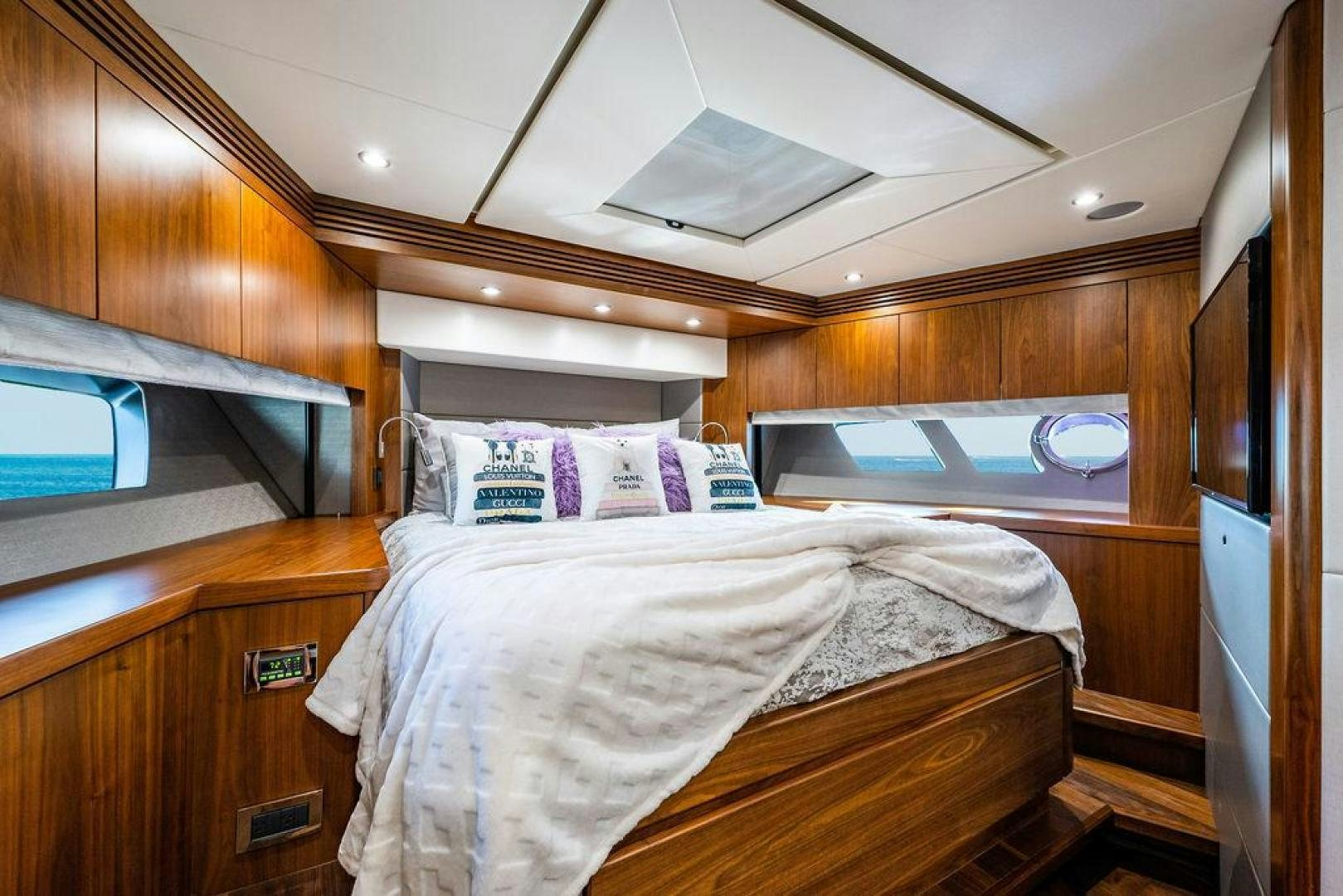 a room with a bed and a television aboard RAPALLO V Yacht for Sale