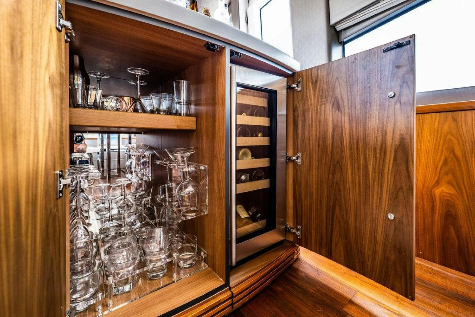 a cabinet with glass doors aboard RAPALLO V Yacht for Sale