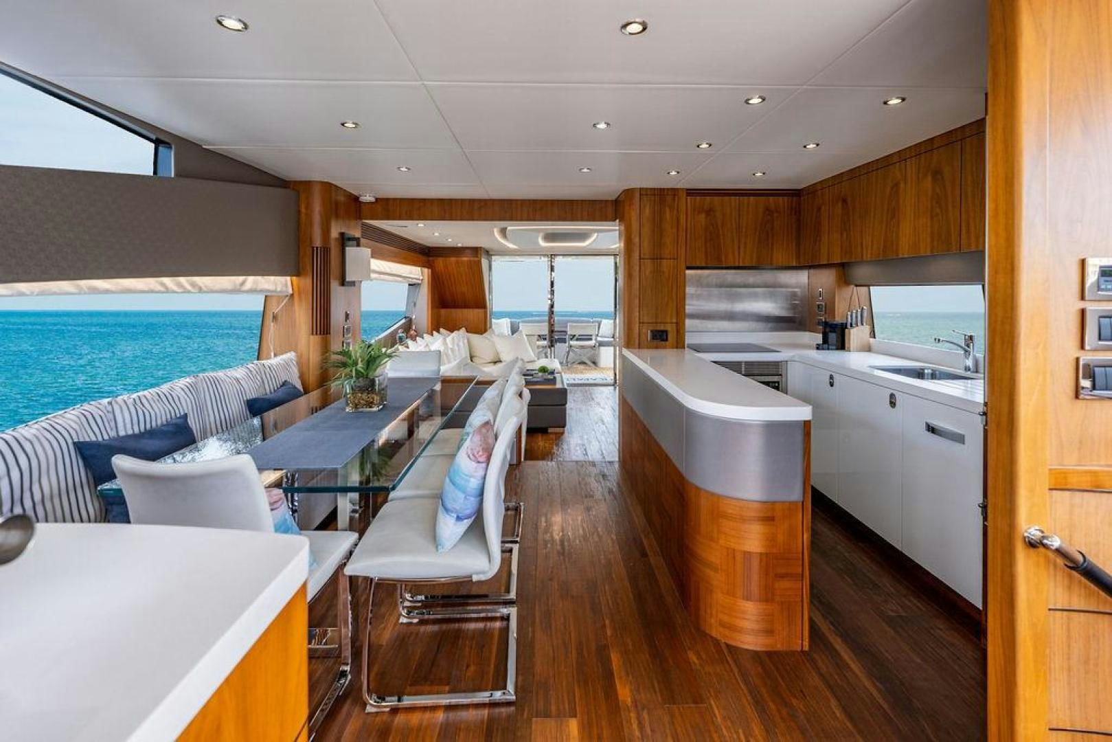 a living room with a wood floor aboard RAPALLO V Yacht for Sale