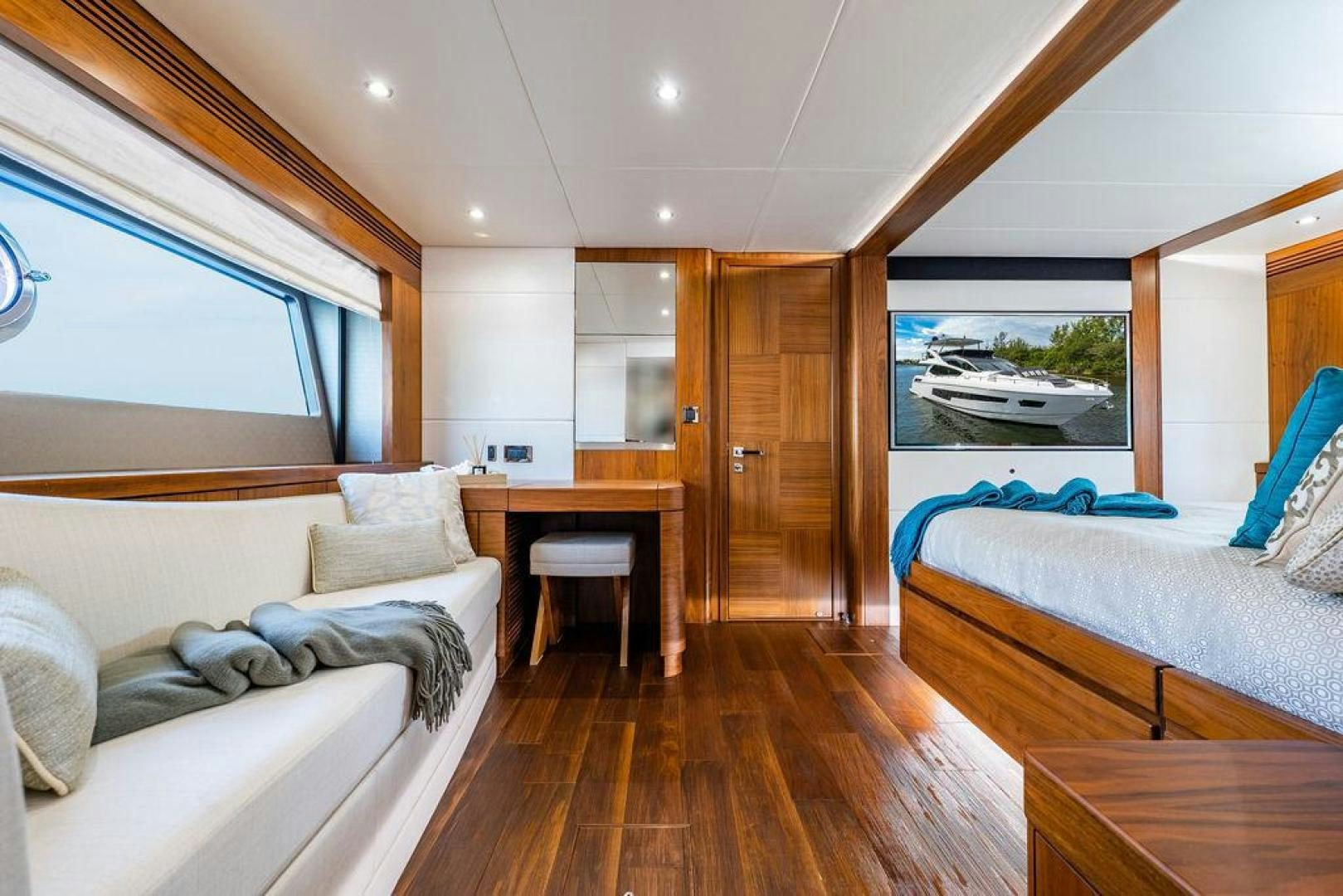 a room with a bed and a table aboard RAPALLO V Yacht for Sale