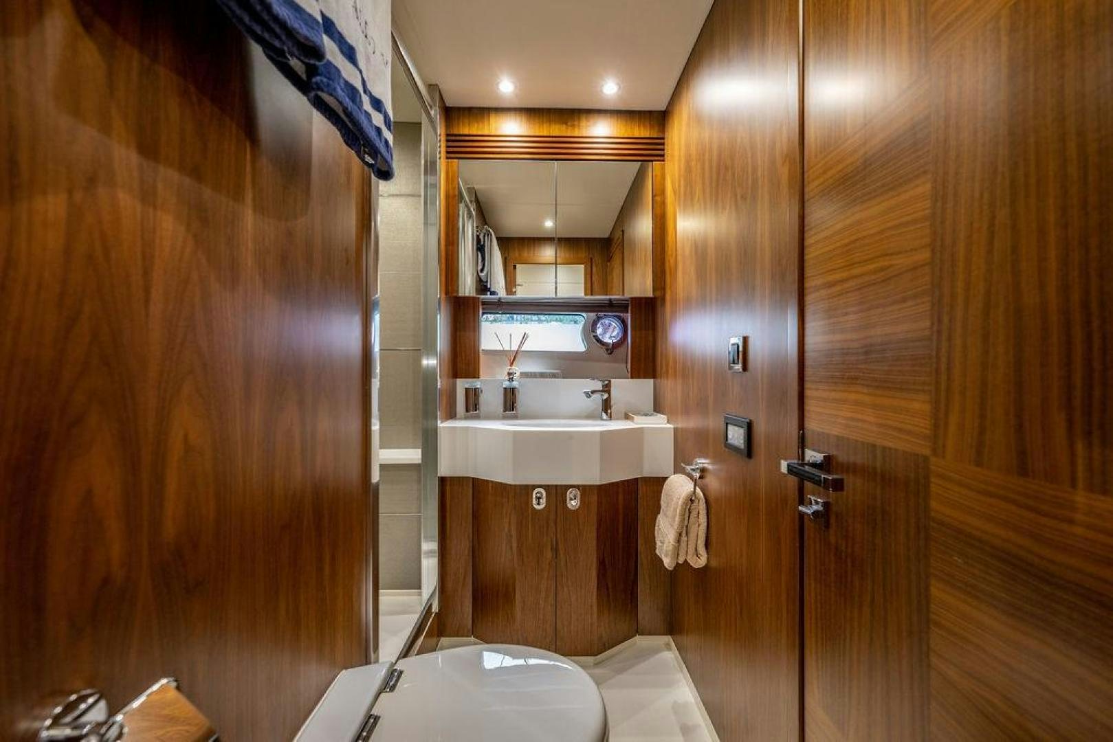 a bathroom with a sink and a toilet aboard RAPALLO V Yacht for Sale
