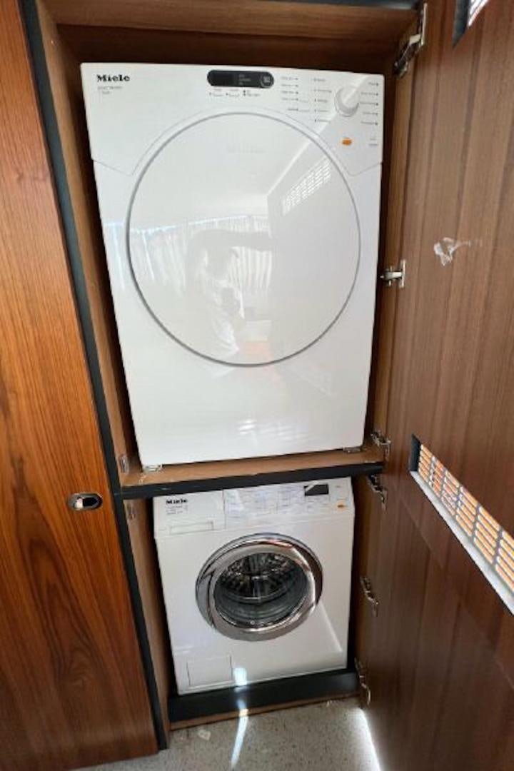 a washing machine in a closet aboard RAPALLO V Yacht for Sale