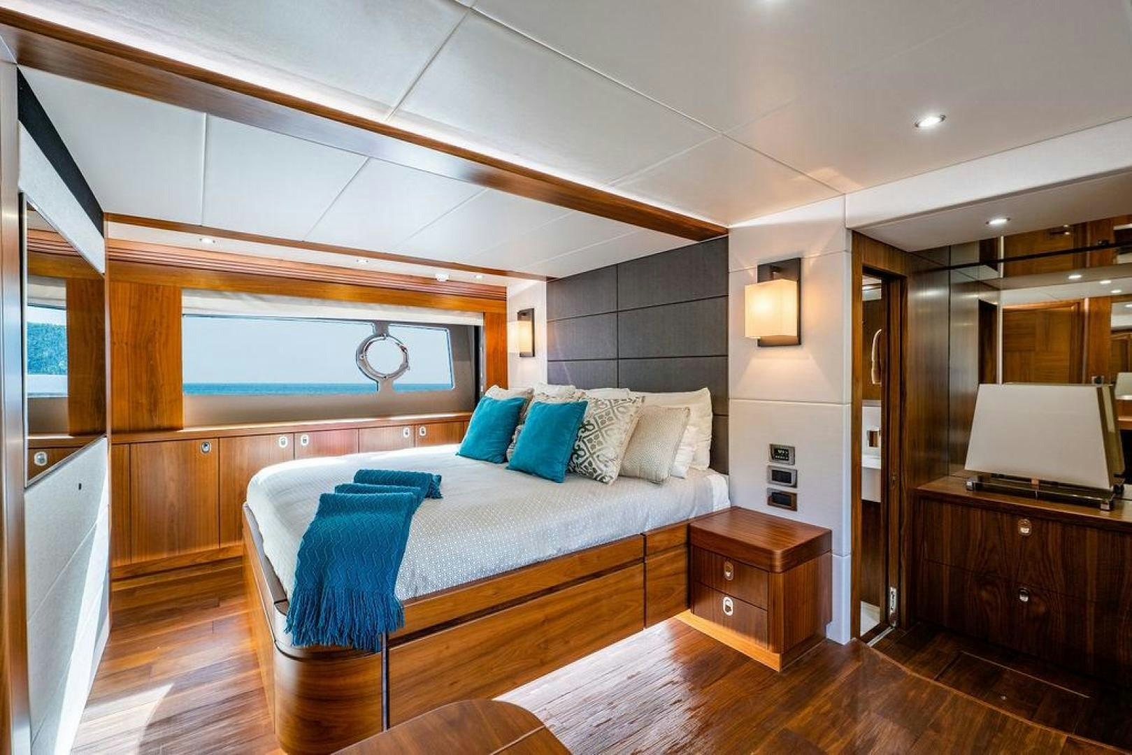 a bedroom with a bed and a television aboard RAPALLO V Yacht for Sale