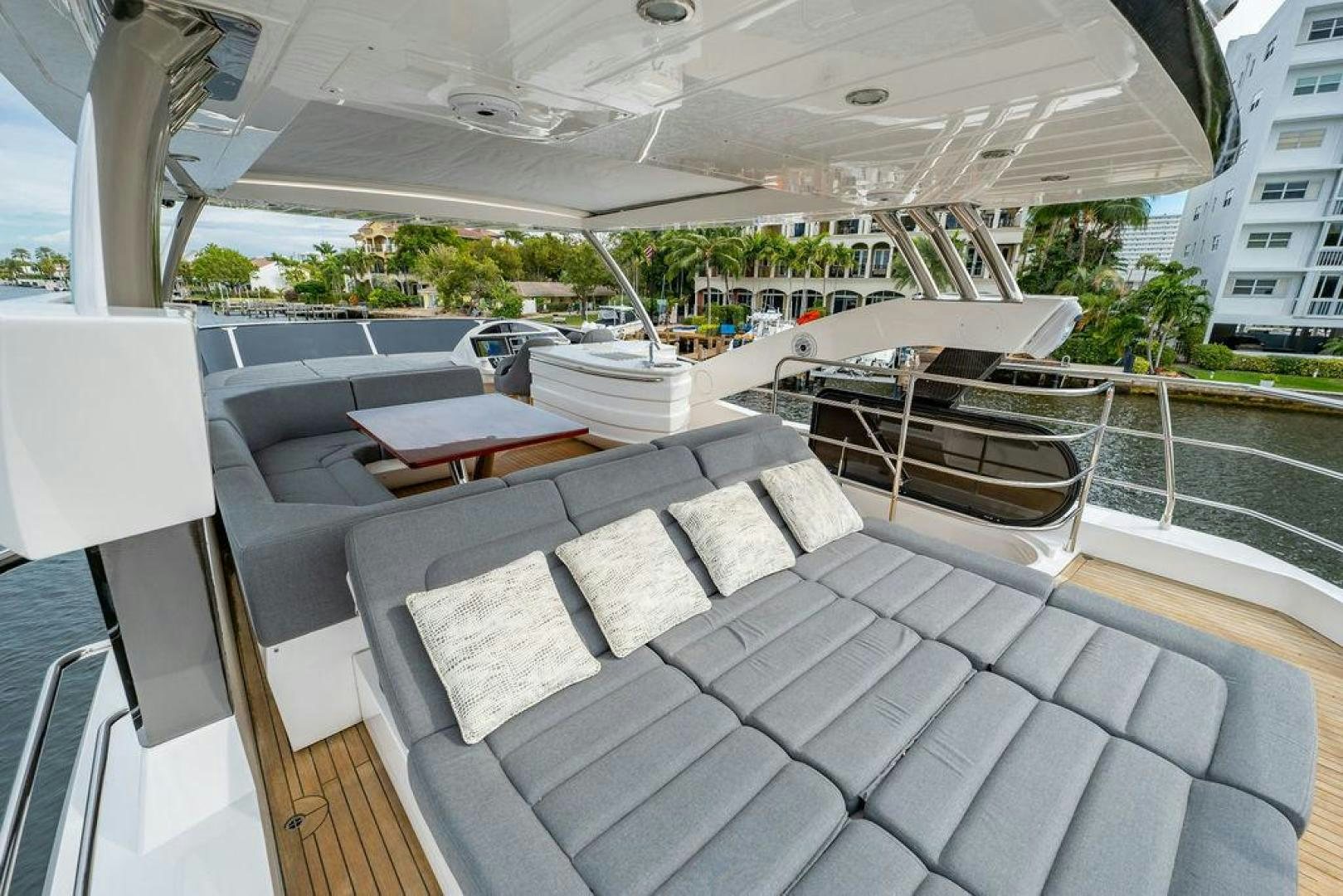 a deck with a table and chairs aboard RAPALLO V Yacht for Sale