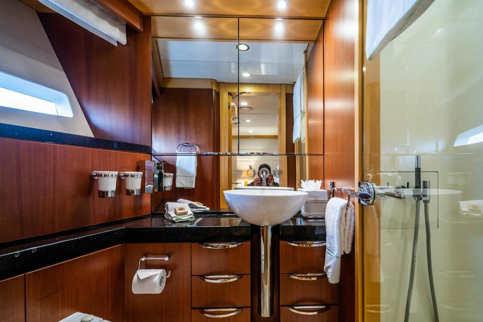 a bathroom with a sink and mirror aboard MY SPIRIT Yacht for Sale