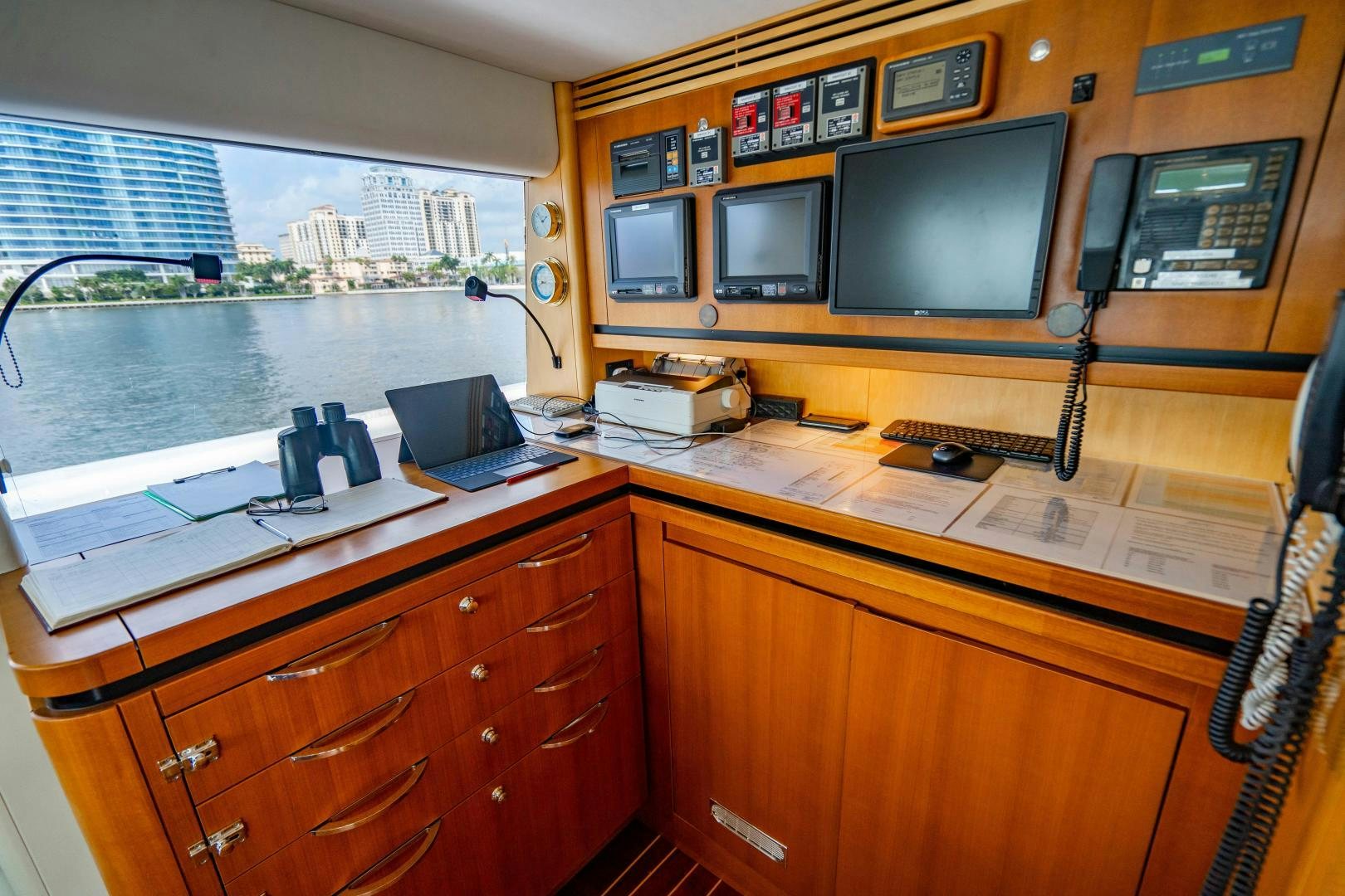 a laptop sits on a desk aboard MY SPIRIT Yacht for Sale