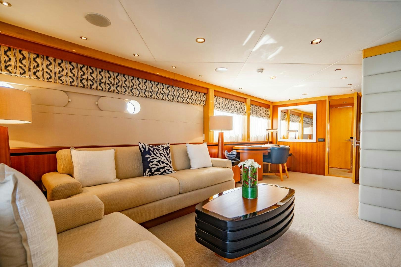 a living room with a couch and a table aboard MY SPIRIT Yacht for Sale