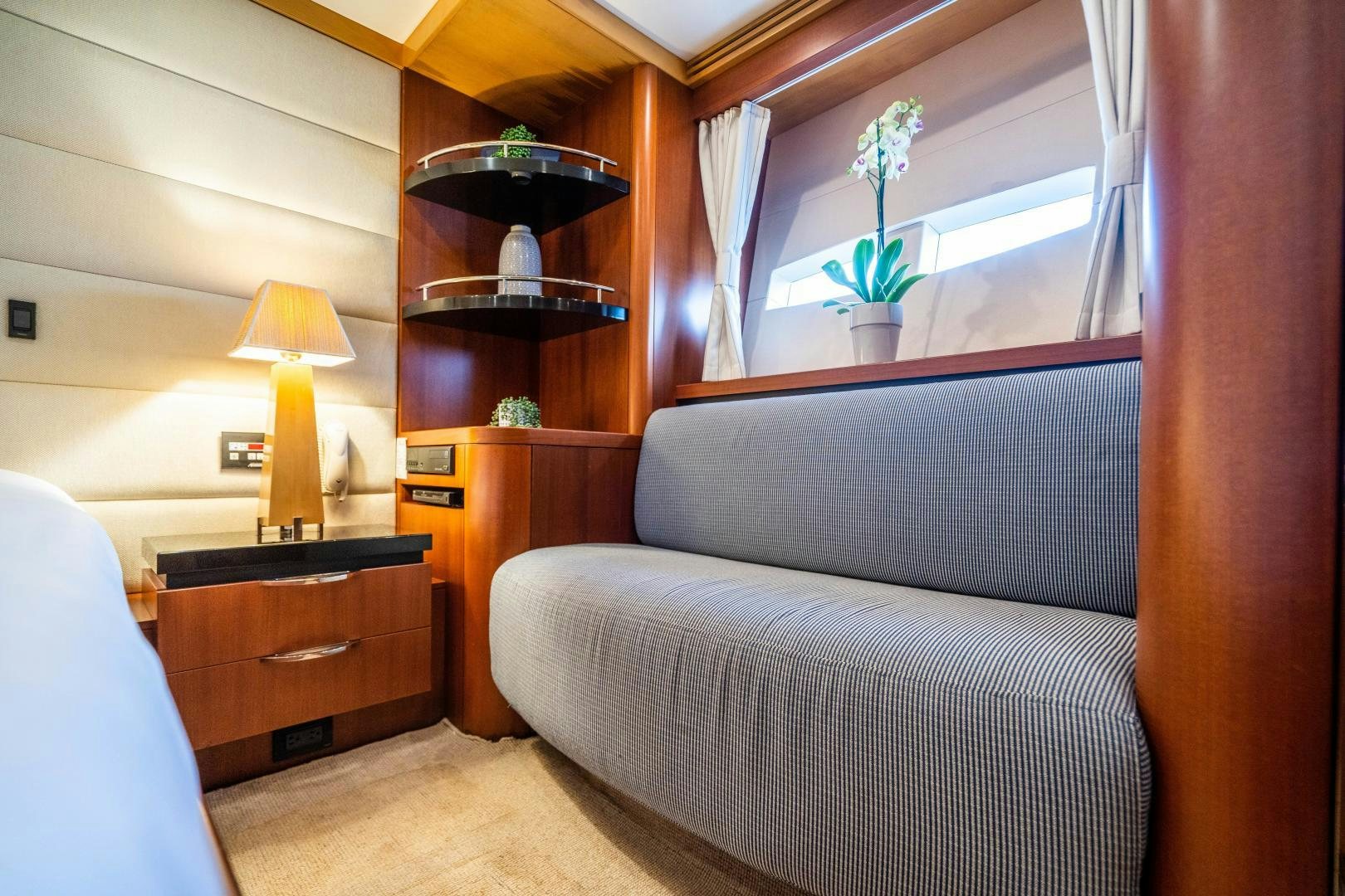 a bedroom with a bed and a shelf aboard MY SPIRIT Yacht for Sale