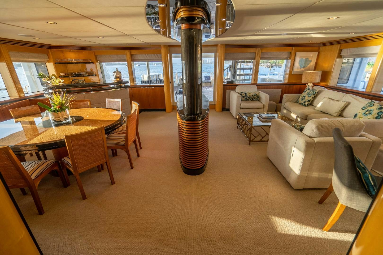 a large room with a table and chairs aboard MY SPIRIT Yacht for Sale