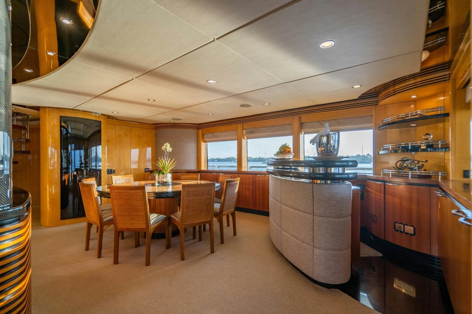 a kitchen with a table and chairs aboard MY SPIRIT Yacht for Sale