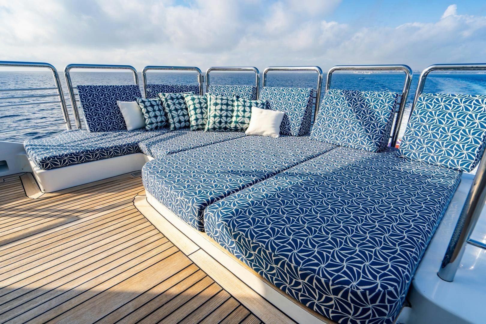 a deck with chairs and a table aboard MY SPIRIT Yacht for Sale